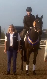 Tamsyn Iveson and Enniscrone Morgan Gold receiving their rosette at BRC Intermediate Winter Dressage Championships 2019.