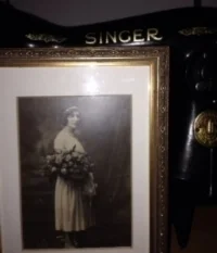 Mary Adorno Velleca, at her sister's wedding, circa 1921, and her old Singer