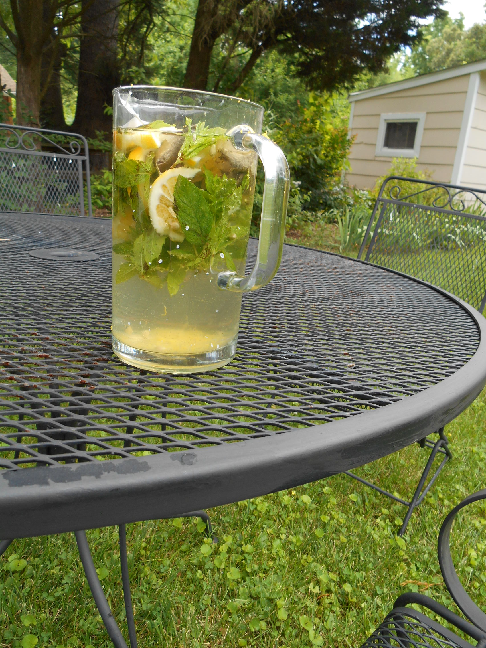What a difference cool air in July makes here in Maryland! Rowing out to Lark, for a while on board in the early morning, then weeding the asparagus bed, then concocting some sun tea ... green tea with jasmine, handful of mint and juice, grated rind, and sliced up Meyer lemon brought back from the garden of a friend in California .... aaaah .... grateful!