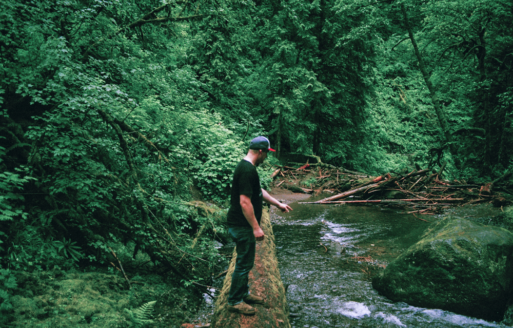 Erik crossing one of the many fallen trees