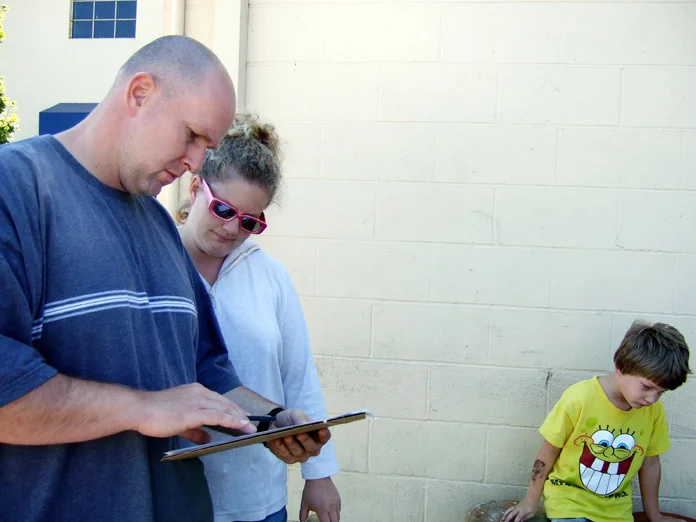 Family being interviewed at the Bins