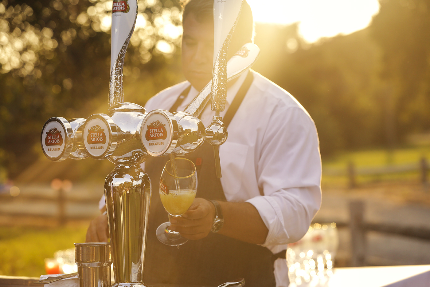 Trained Stella staff serving beers according to the 9 step pouring ritual.