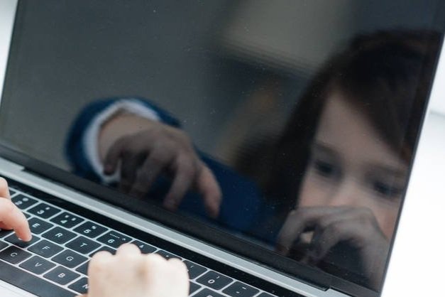 stock-photo-laptop-screen-reflection-cute-child.jpg