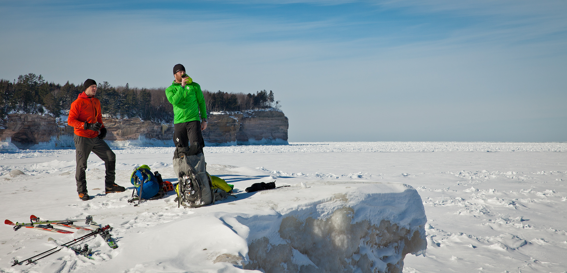 Adam Dailey and Jon Jugenheimer take a rest at Chapel Beach after skiing several miles through the woods of Pictured Rocks National Lakeshore. 