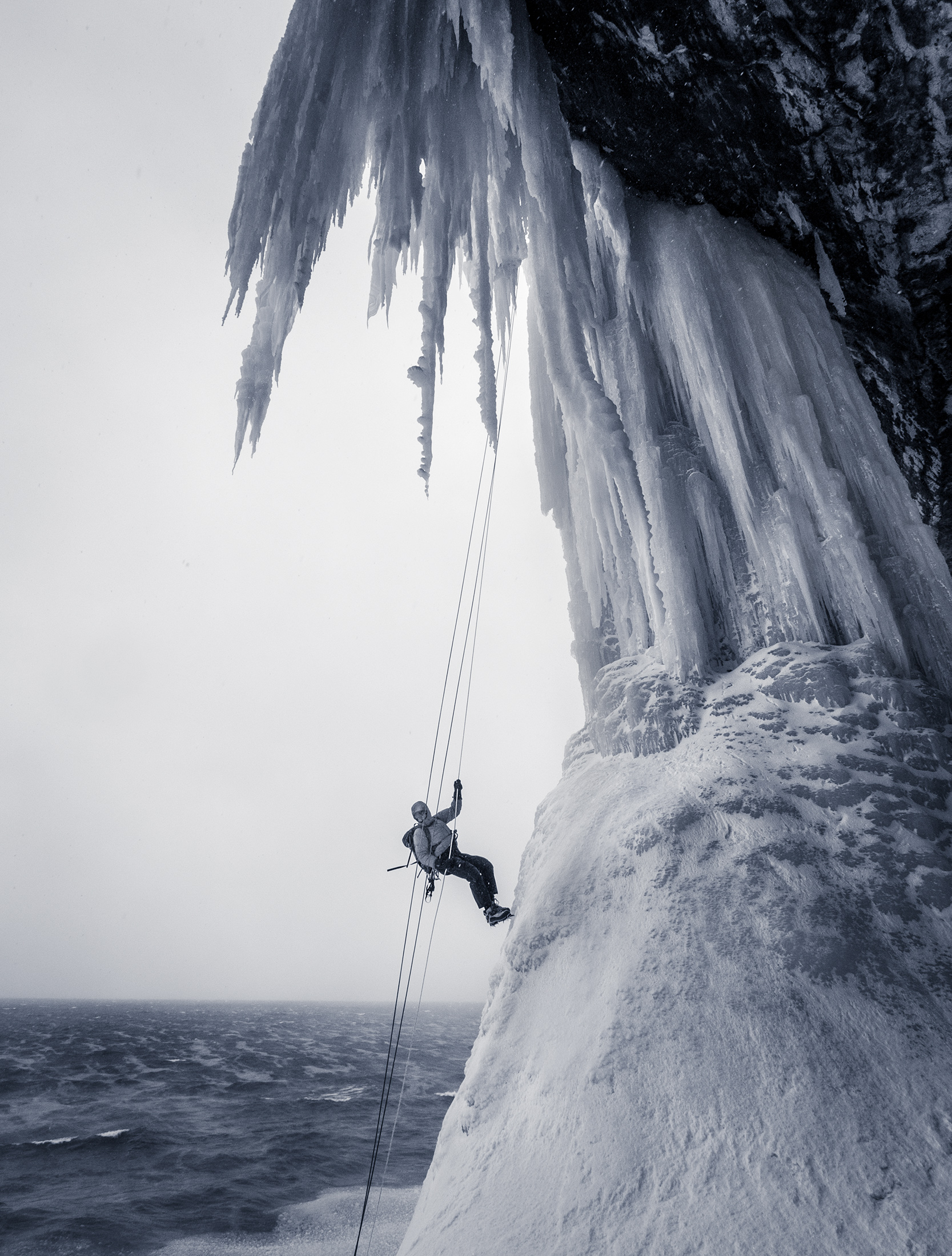  An ice climber rappels down Dairyland over the open water of Lake Superior. 