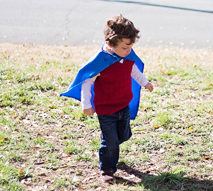 Ben running around in his cape