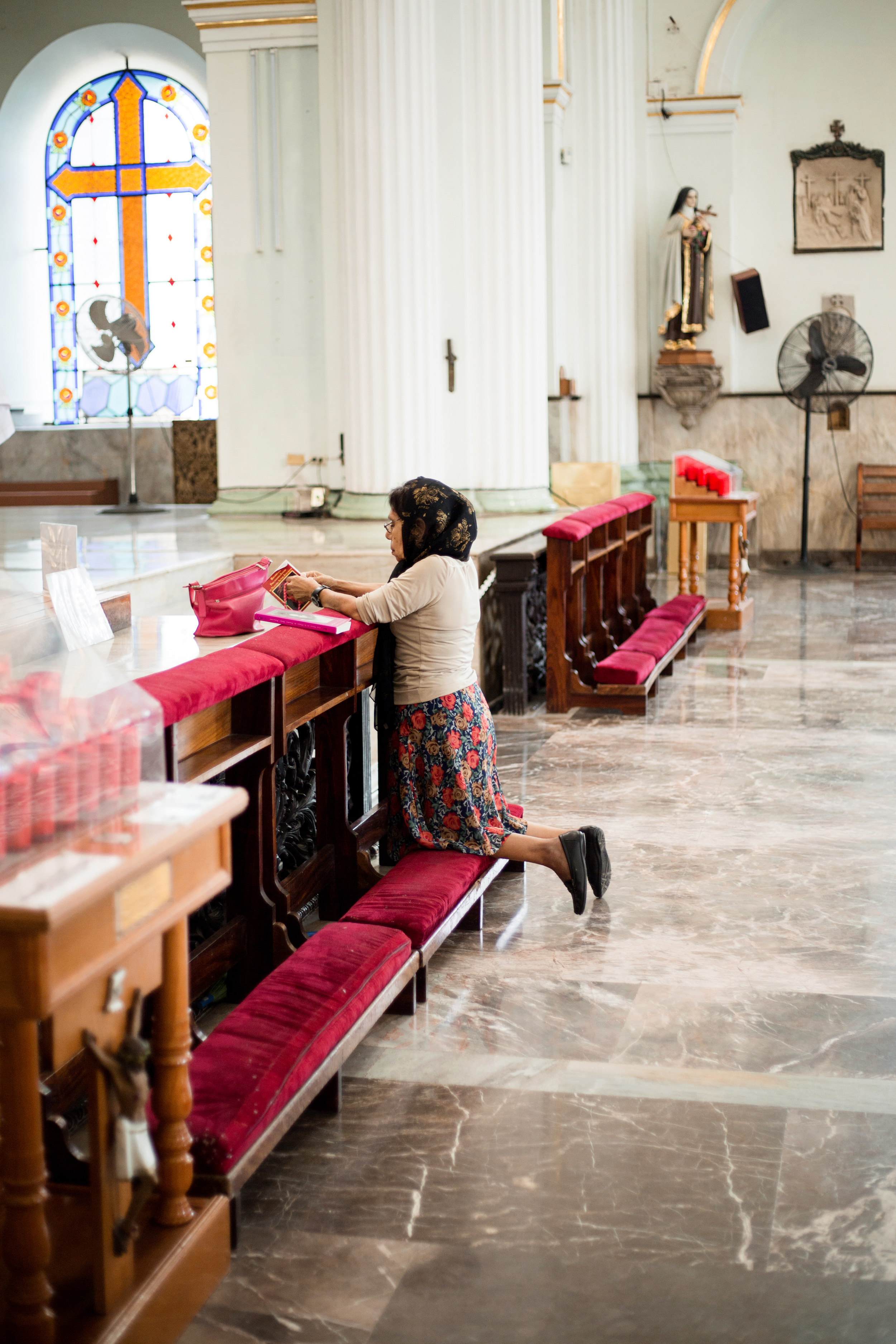 Woman Praying in a Mexican Cathedral