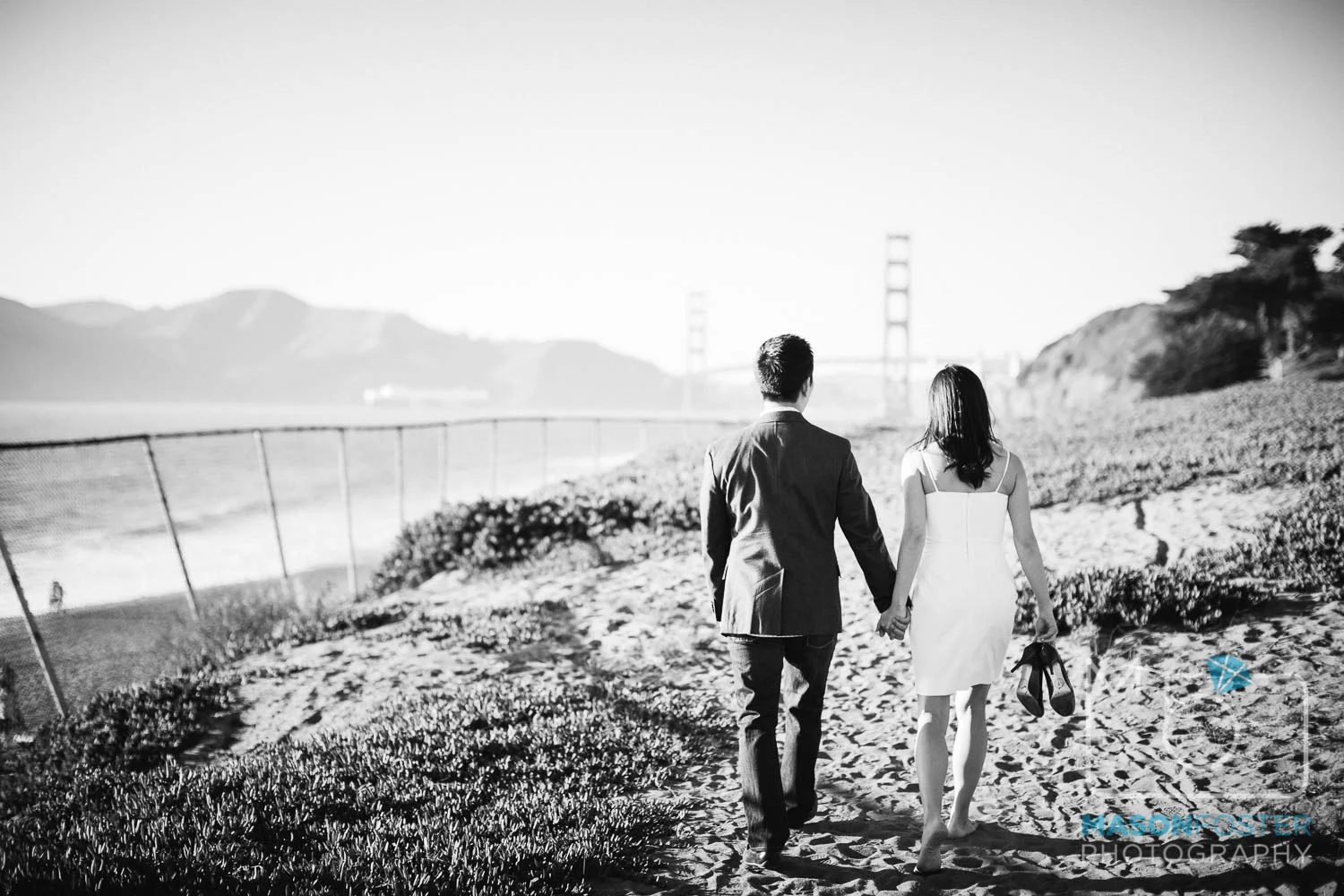 couple walking along baker beach, san francisco - engagement photography