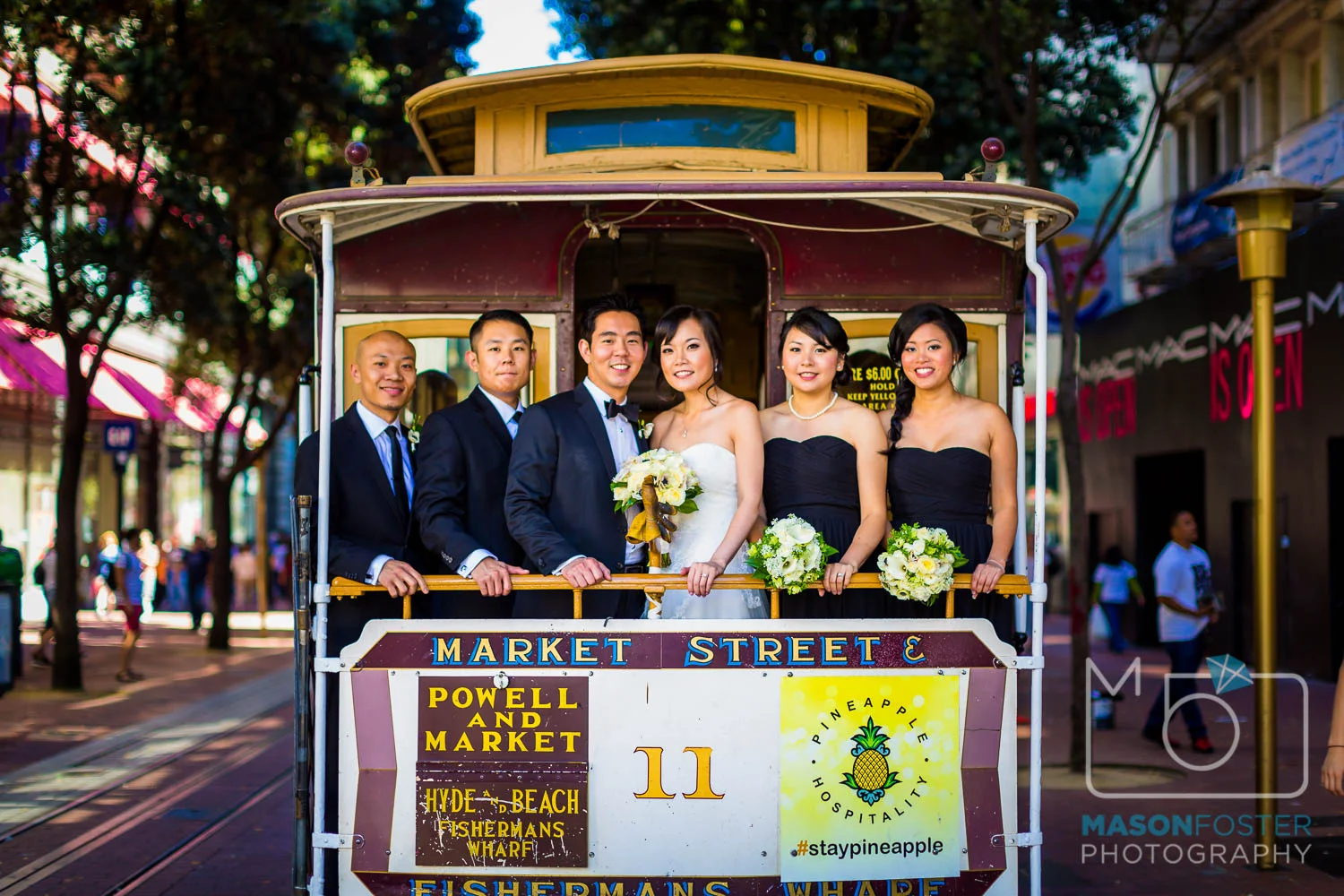 bridal party on cable car , wedding photography at the westin st. francis in san francisco