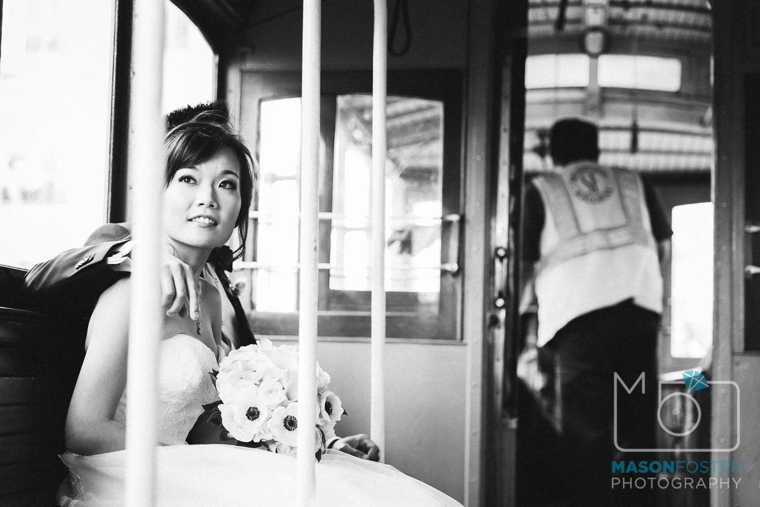bride and groom on cable car , wedding photography at the westin st. francis in san francisco