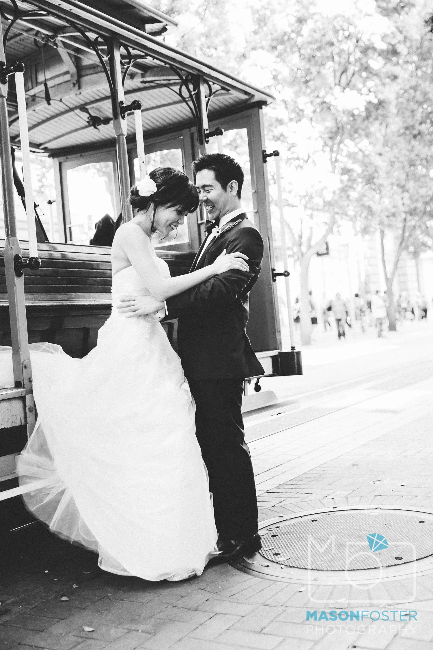 bride and groom on cable car , wedding photography at the westin st. francis in san francisco