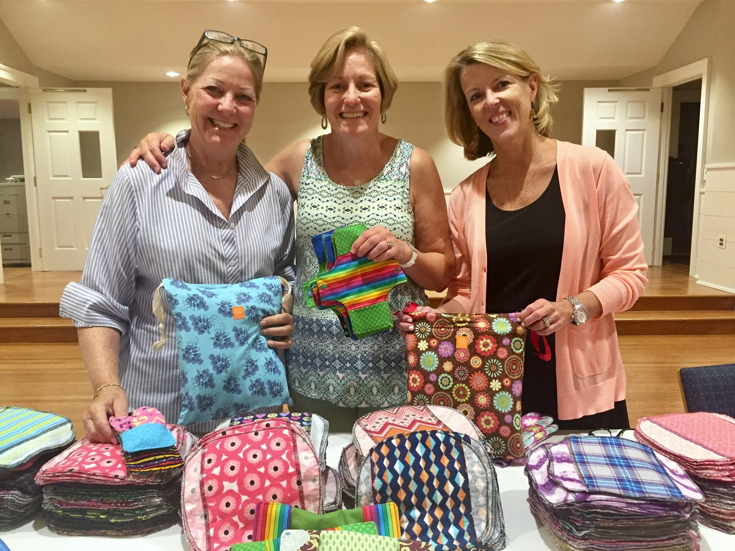 Cissy Claypool, Leslie Roy and Kim Marren and a slew of volunteers created 515 sustainable menstrual kits for girls in Uganda.