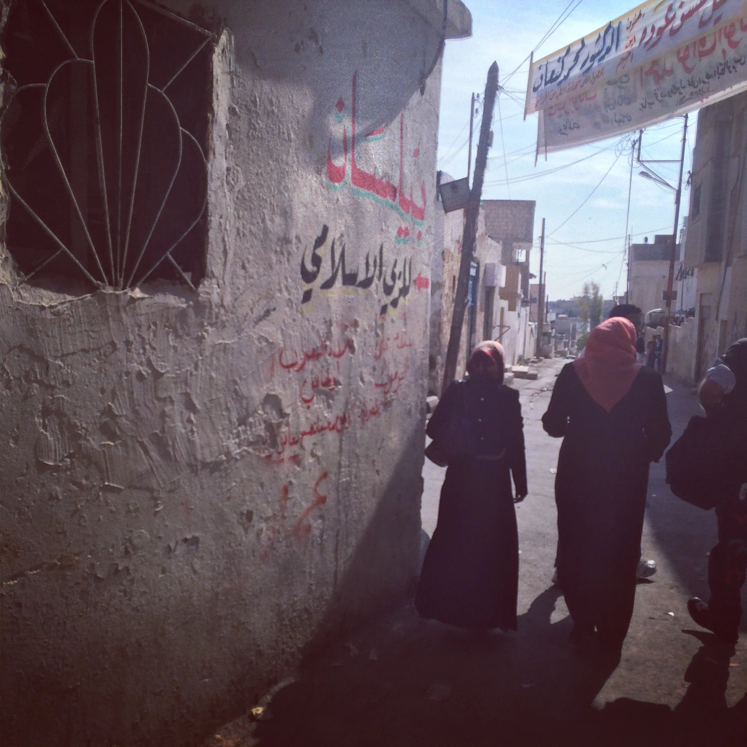 Following women leaders through Madaba Palestinian Refugee Camp in Madaba, Jordan.