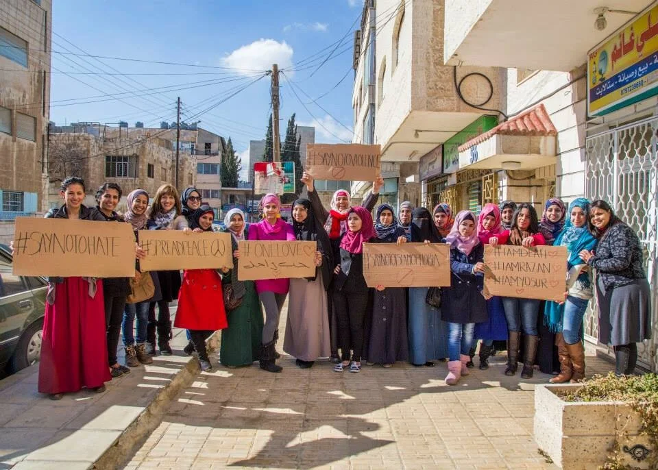 Hopes Scholarship Students, Volunteers, Graduates & Guests joining in one group shot - holding out signs in solidarity with Deah, Razan and Yosur, showing our stance against Hate, Violence and Islamophobia, and our passion for Peace and One Love on this Valentine's Day.