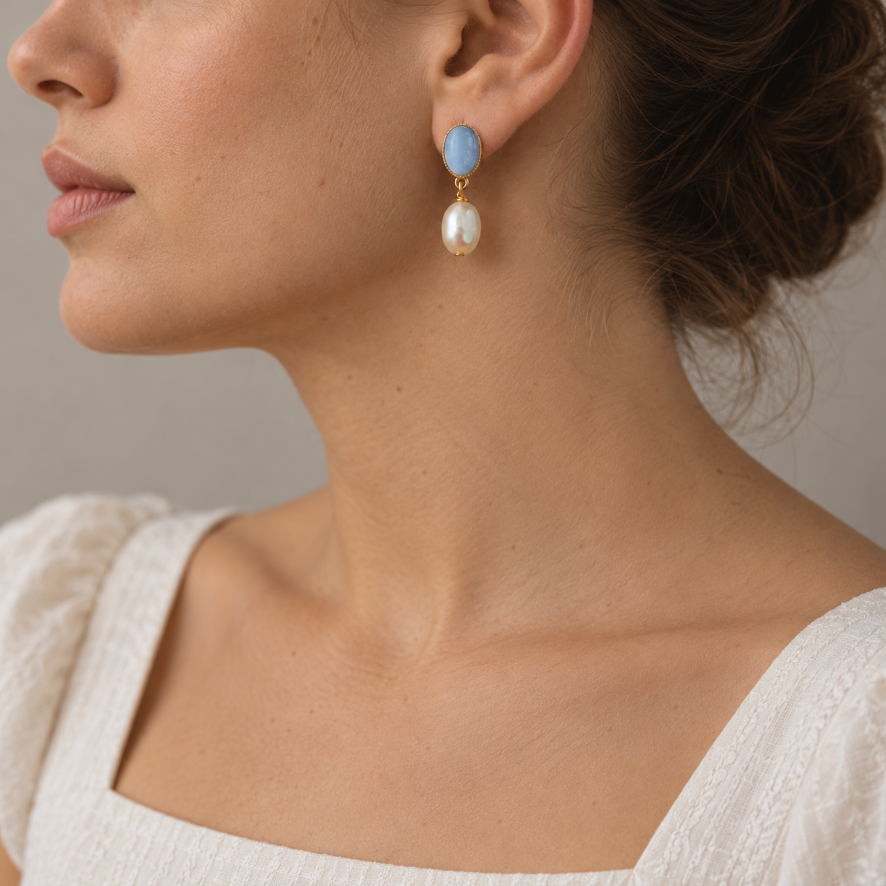 Blue Cabochon Pearl Earring Portrait.png