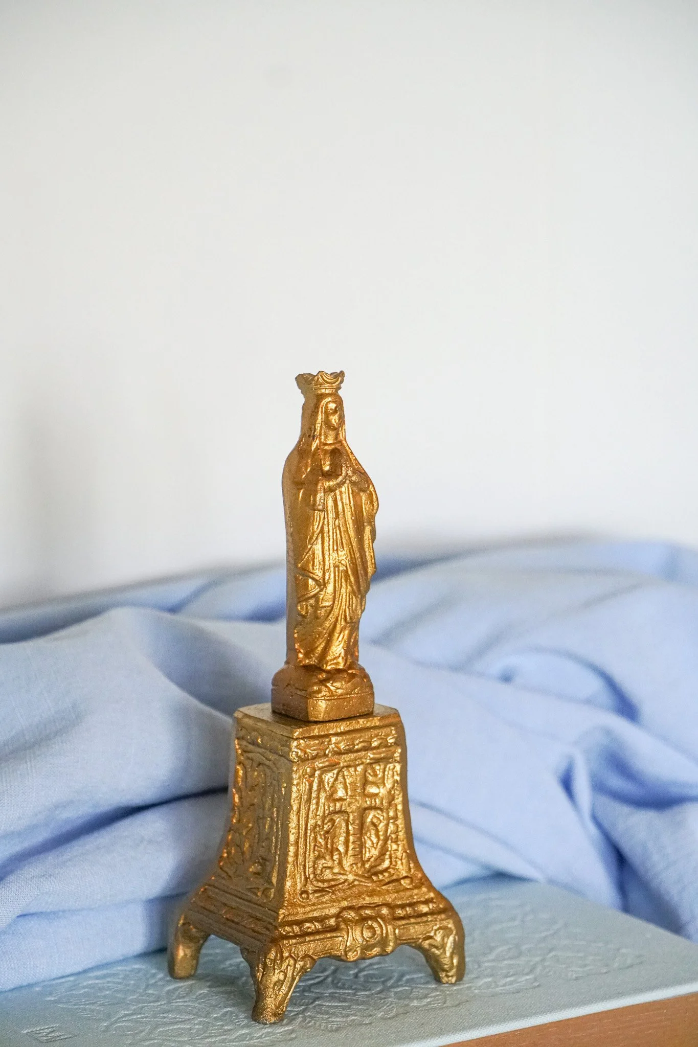 Golden Blessed Mother Statue on Pedestal