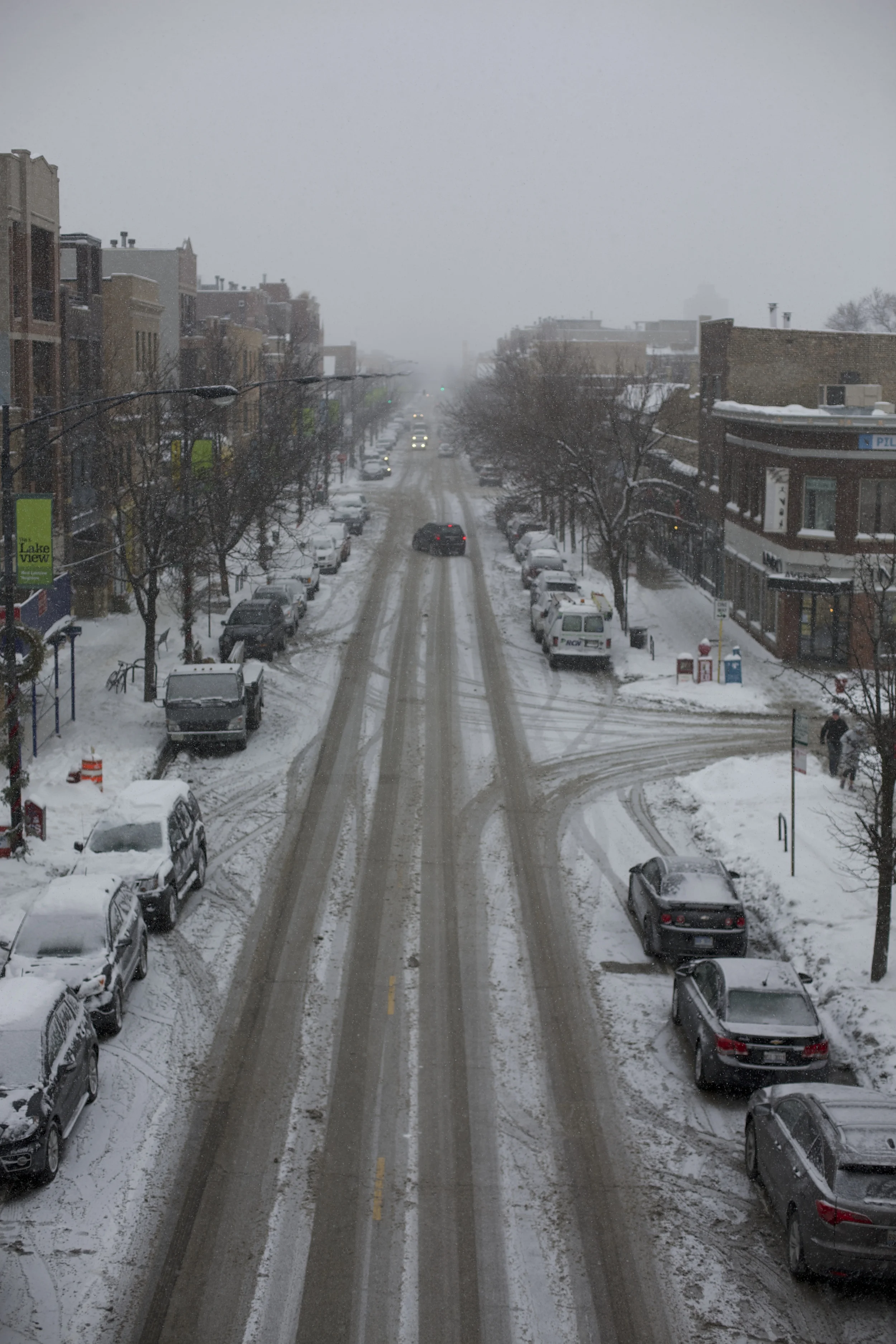 The streets appear clear, but they are still covered in slippery slush despite the constant plowing
