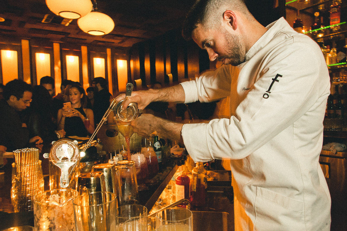  Bartender pouring cocktails at the new West Hollywood Employees Only.  “ Friends and Family”  private opening event. 