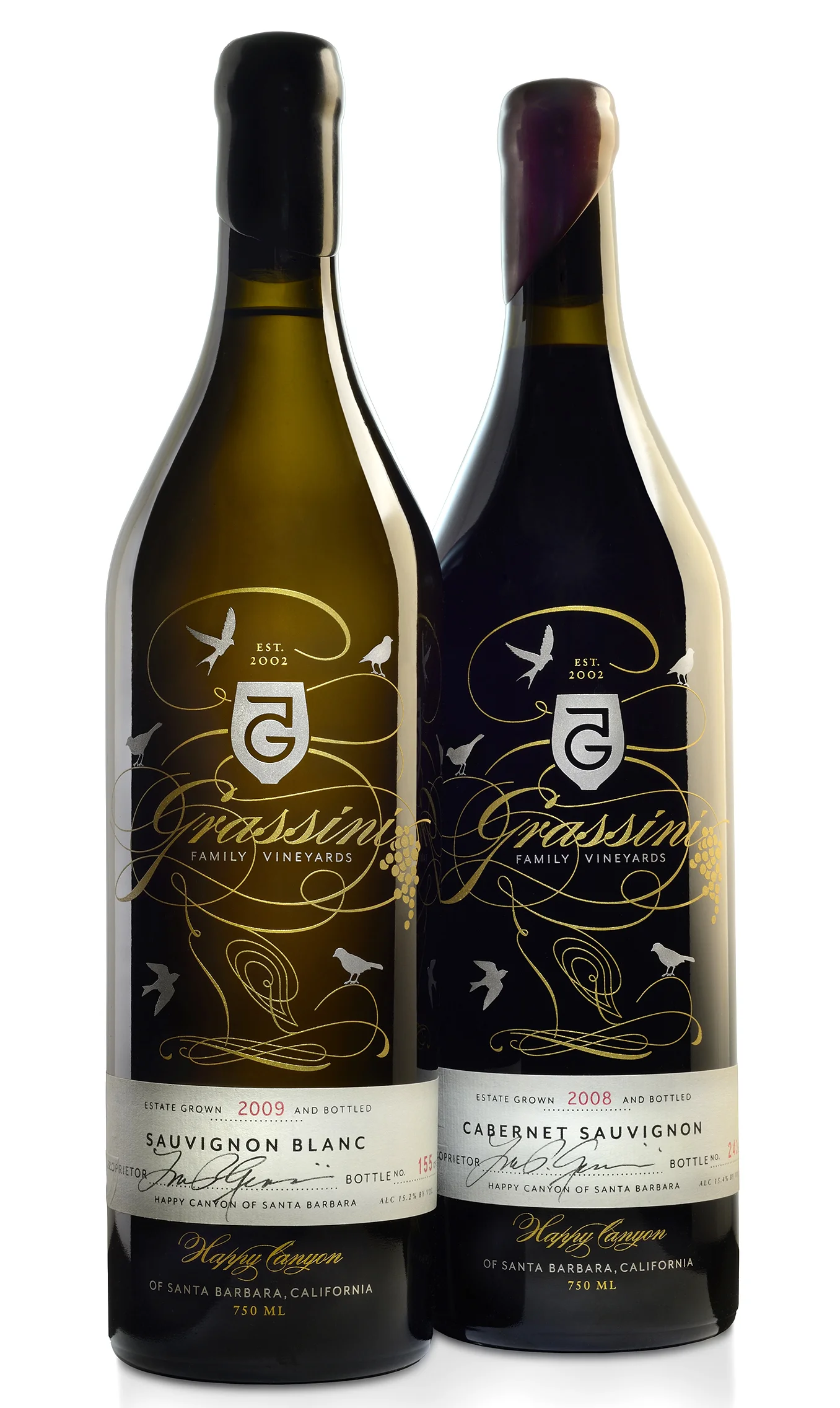 Grassini Family Vineyards designed for Duffy & Partners | The Type Directors Club Award Winner A hand-affixed, letterpressed paper label, signed and numbered by the vinter, wraps an Italian-imported, metallic screenprinted-etched bottle that is capped off with a hand-dipped wax seal for the ultimate finish.