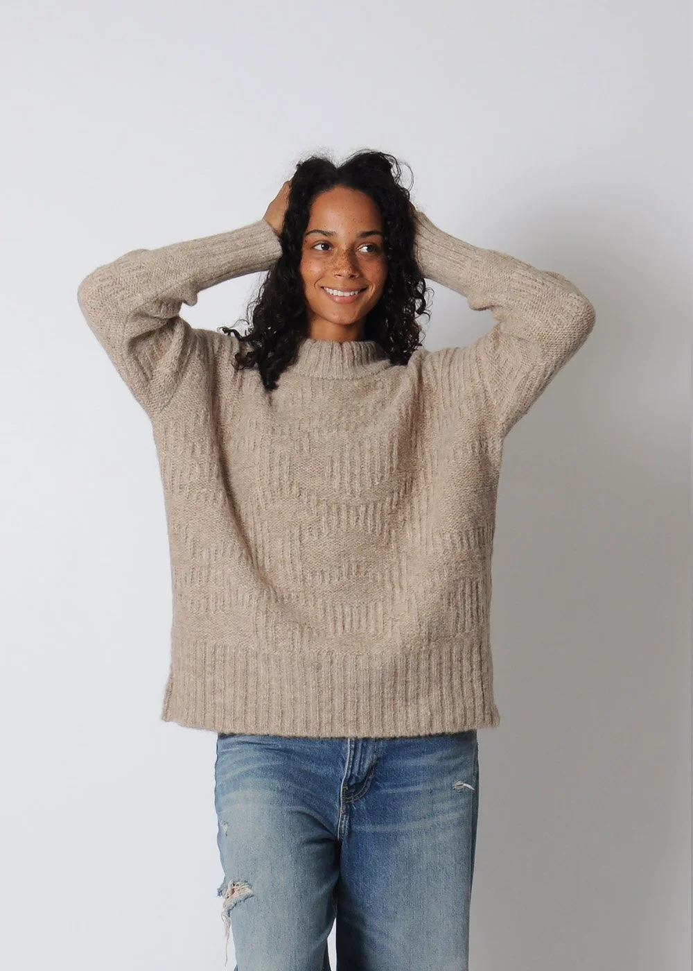 mirth_sweater_armsup.jpg