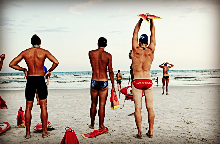 Lifeguards stretch for swim.