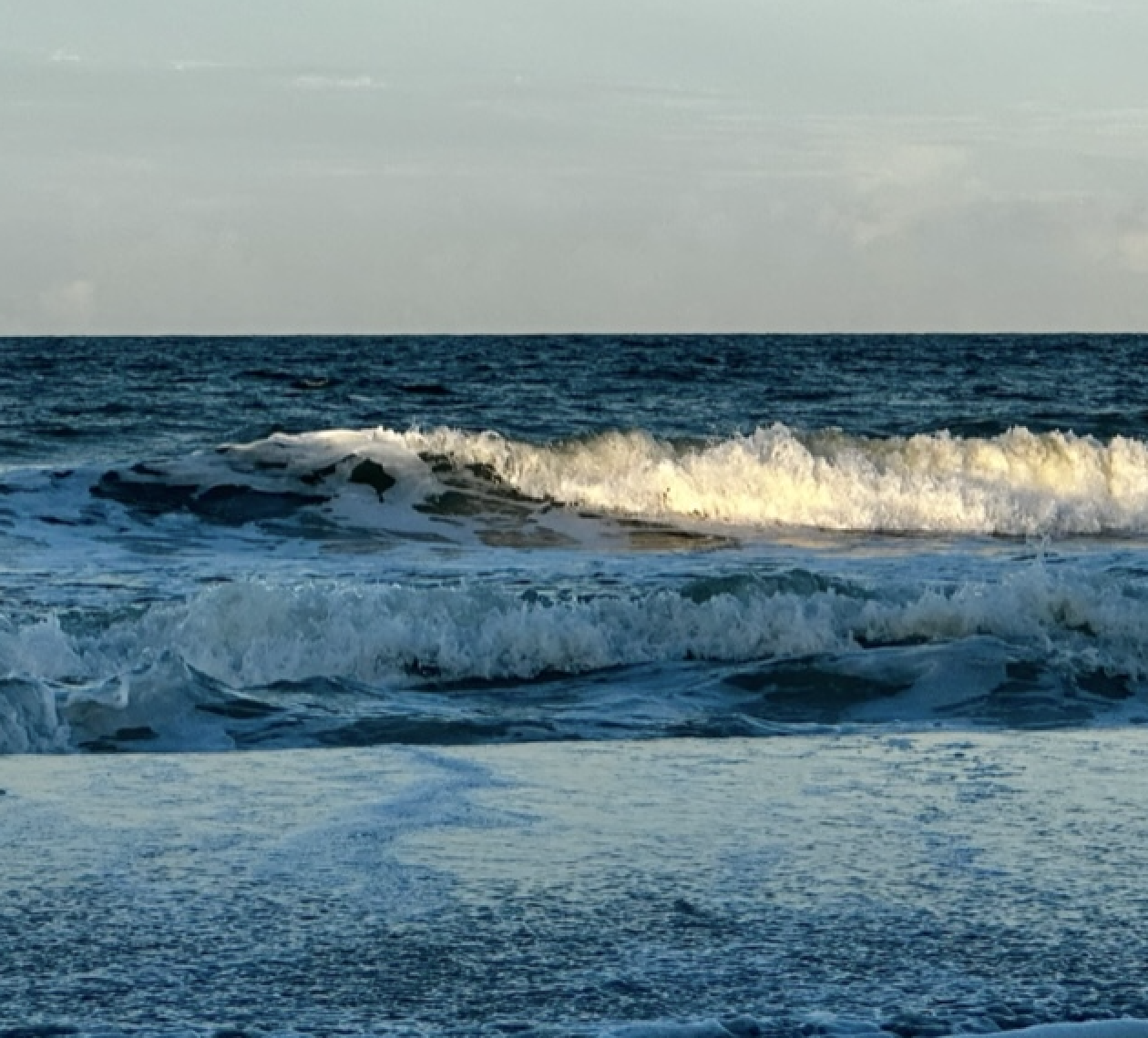 Wave crashing over Blue Ocean