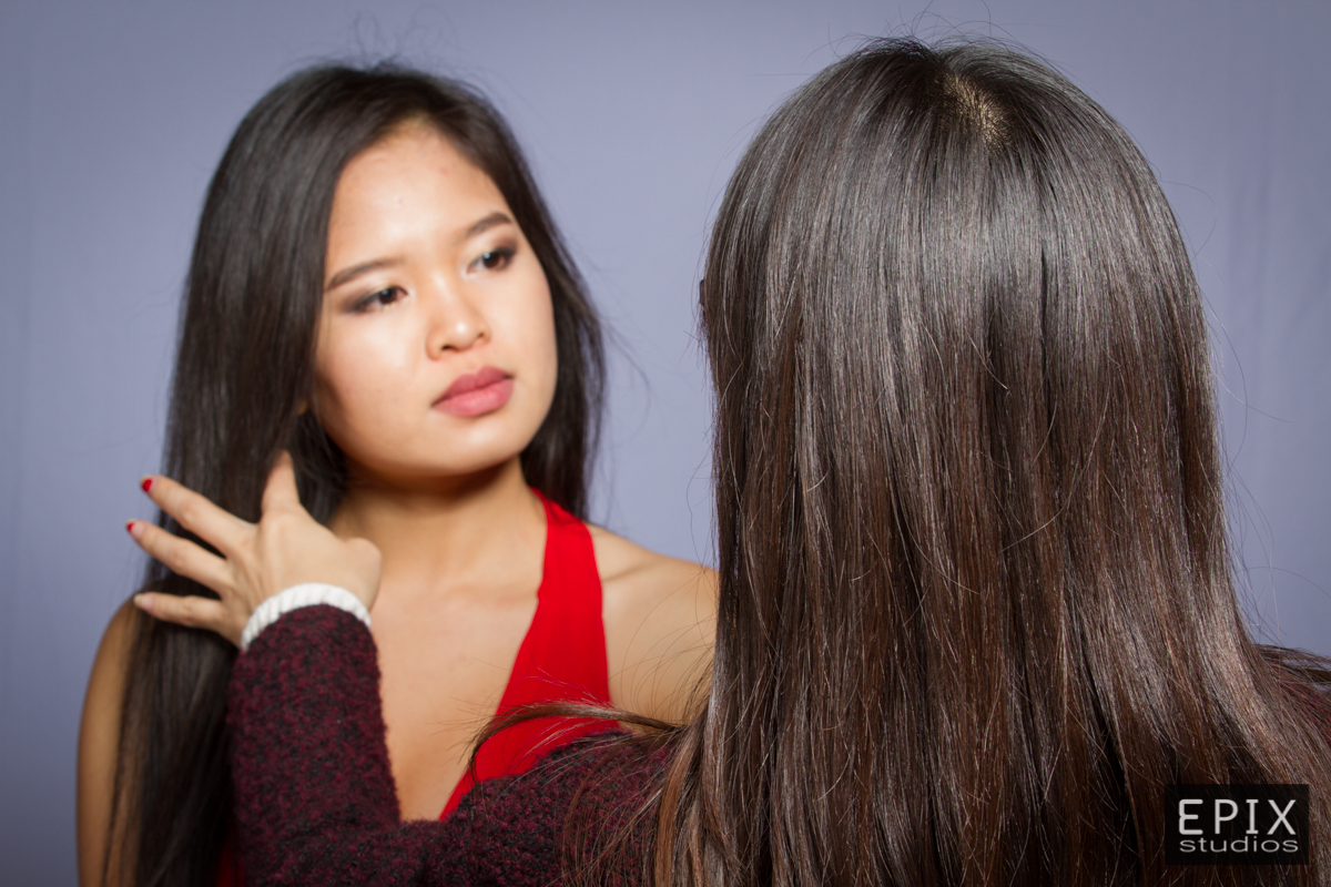 Our in house stylist fixing the hair of one of the Miss Vietnam San Diego ™ Contestants.