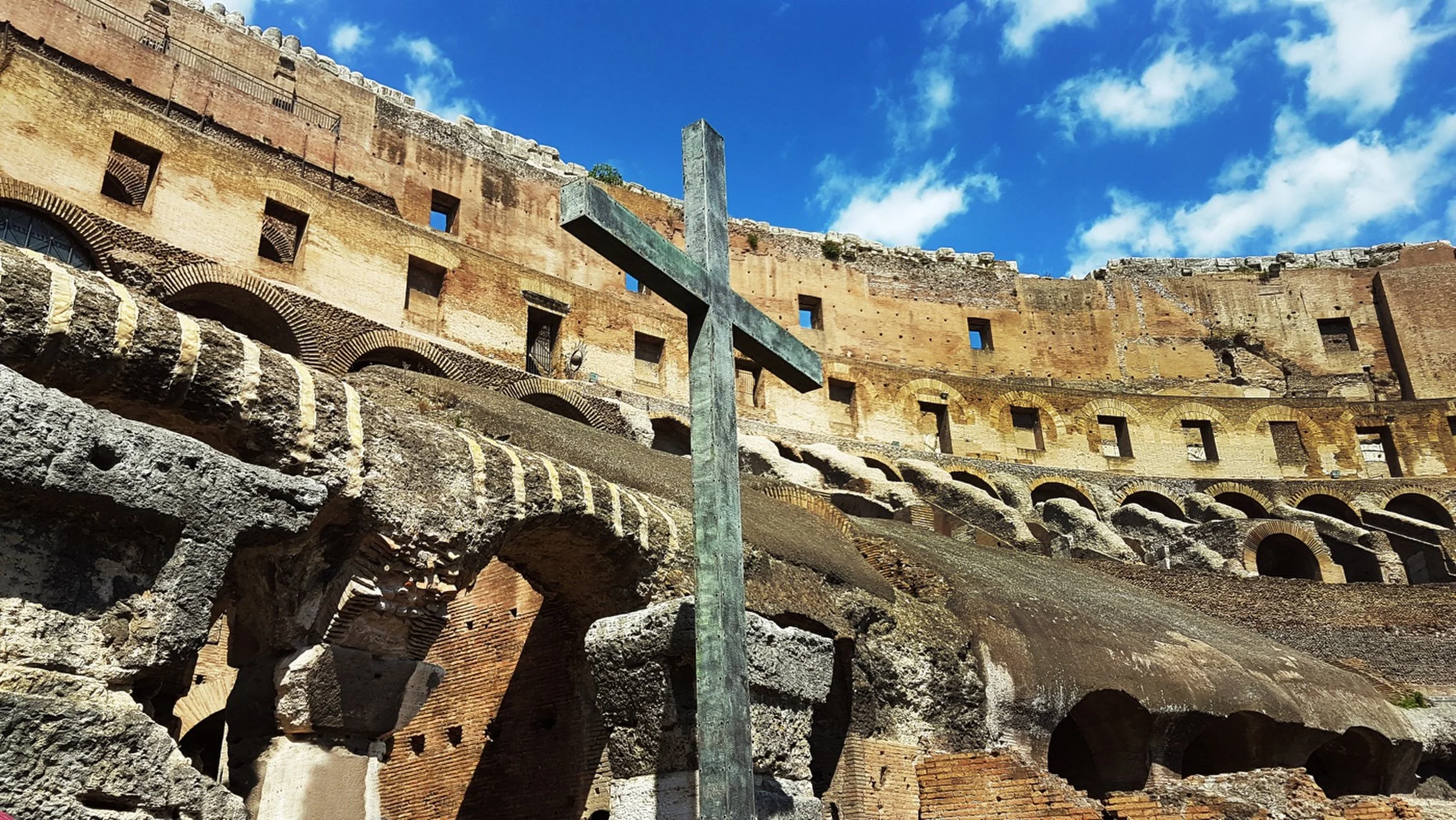 This cross was erected inside the Roman Colosseum as a monument to the suffering of early Christians in Rome. The Christian Bible describes the crucifixion of Jesus Christ as occurring in Jerusalem under Roman rule at the beginning of the Christian …