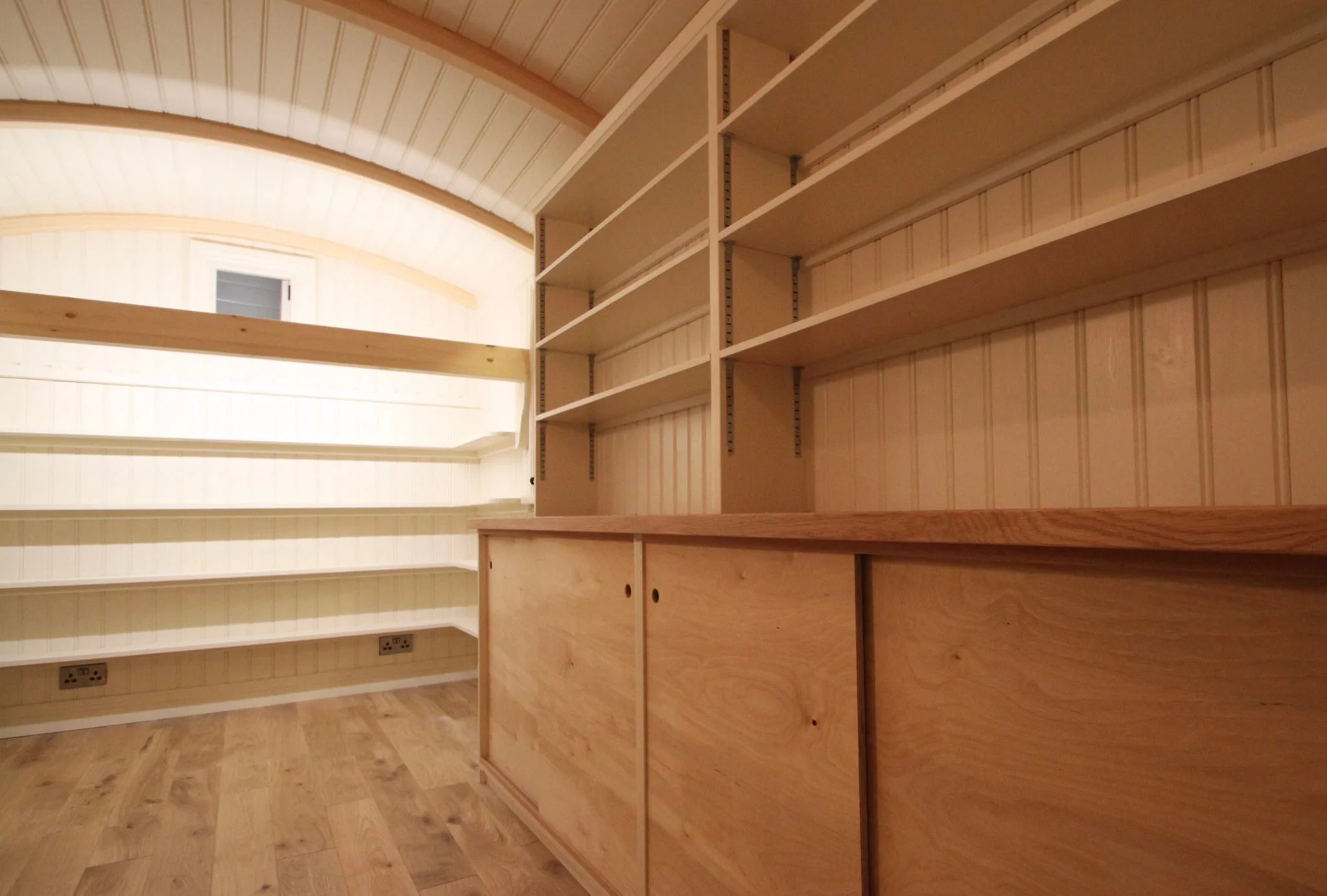 Shepherd's hut library awaiting its shelves to be filled - 'If you have a garden and a library, you have everything you need.' - Marcus Tullius Cicero