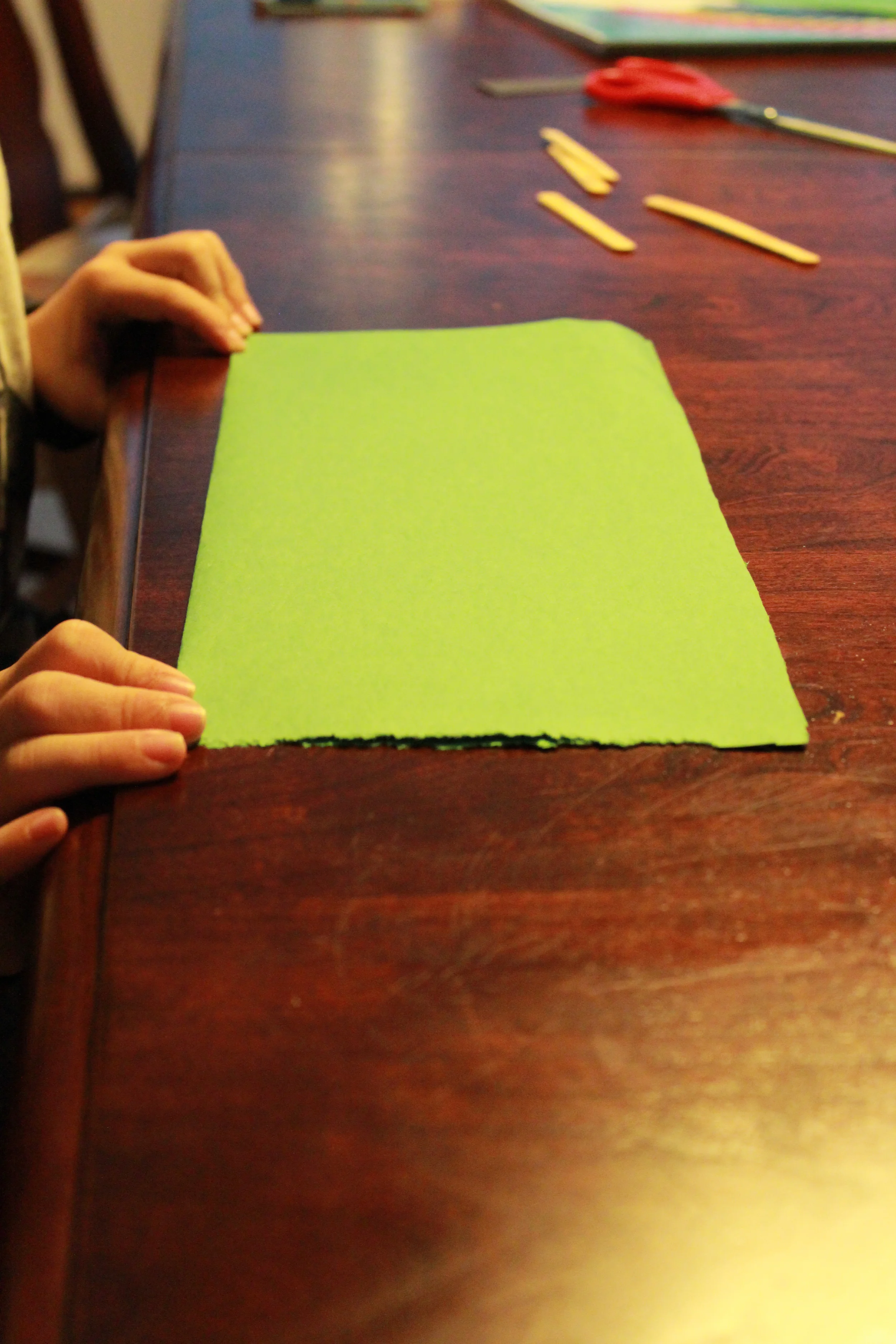 Fold paper in half.