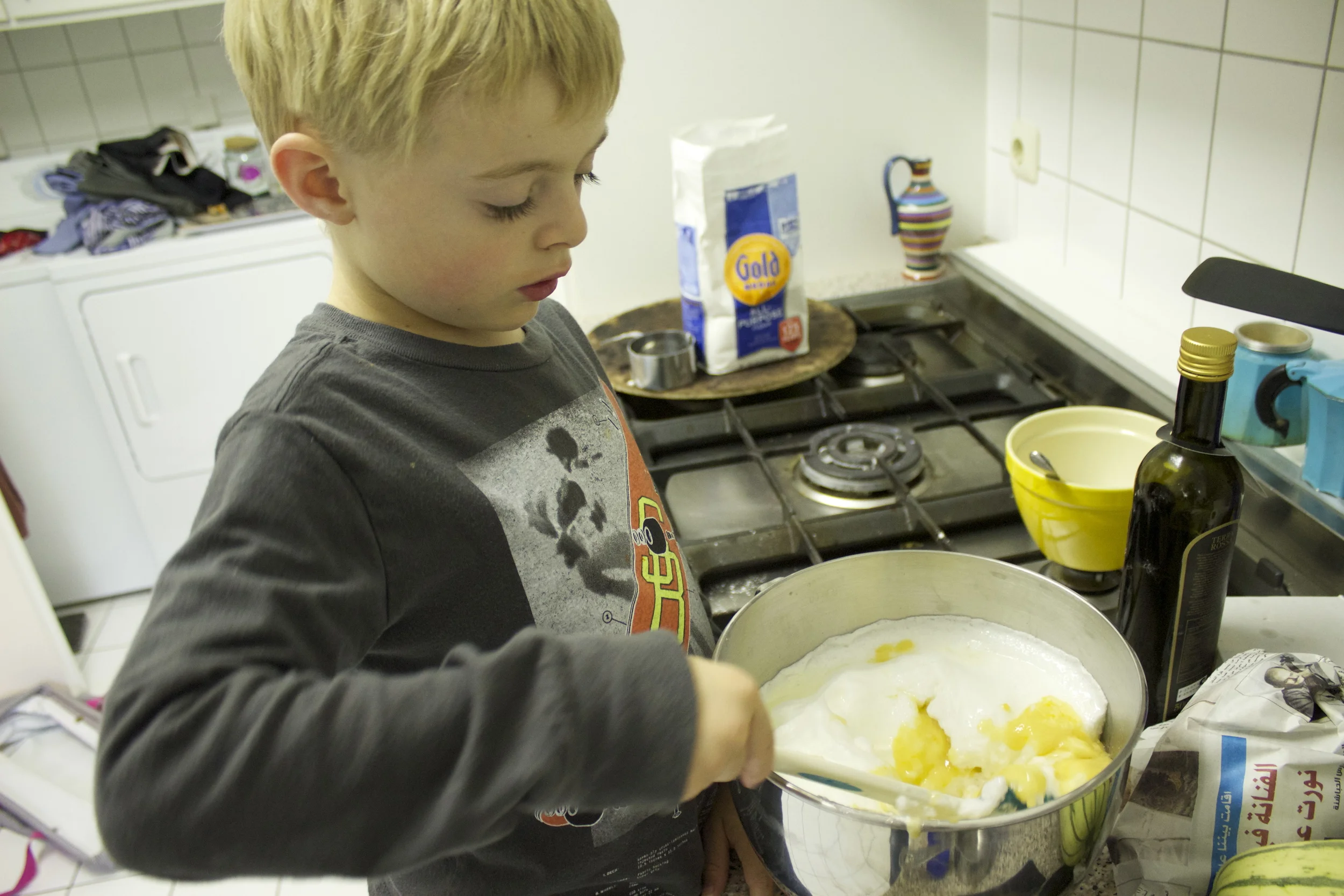 Mixing the whites and yolk mixtures.