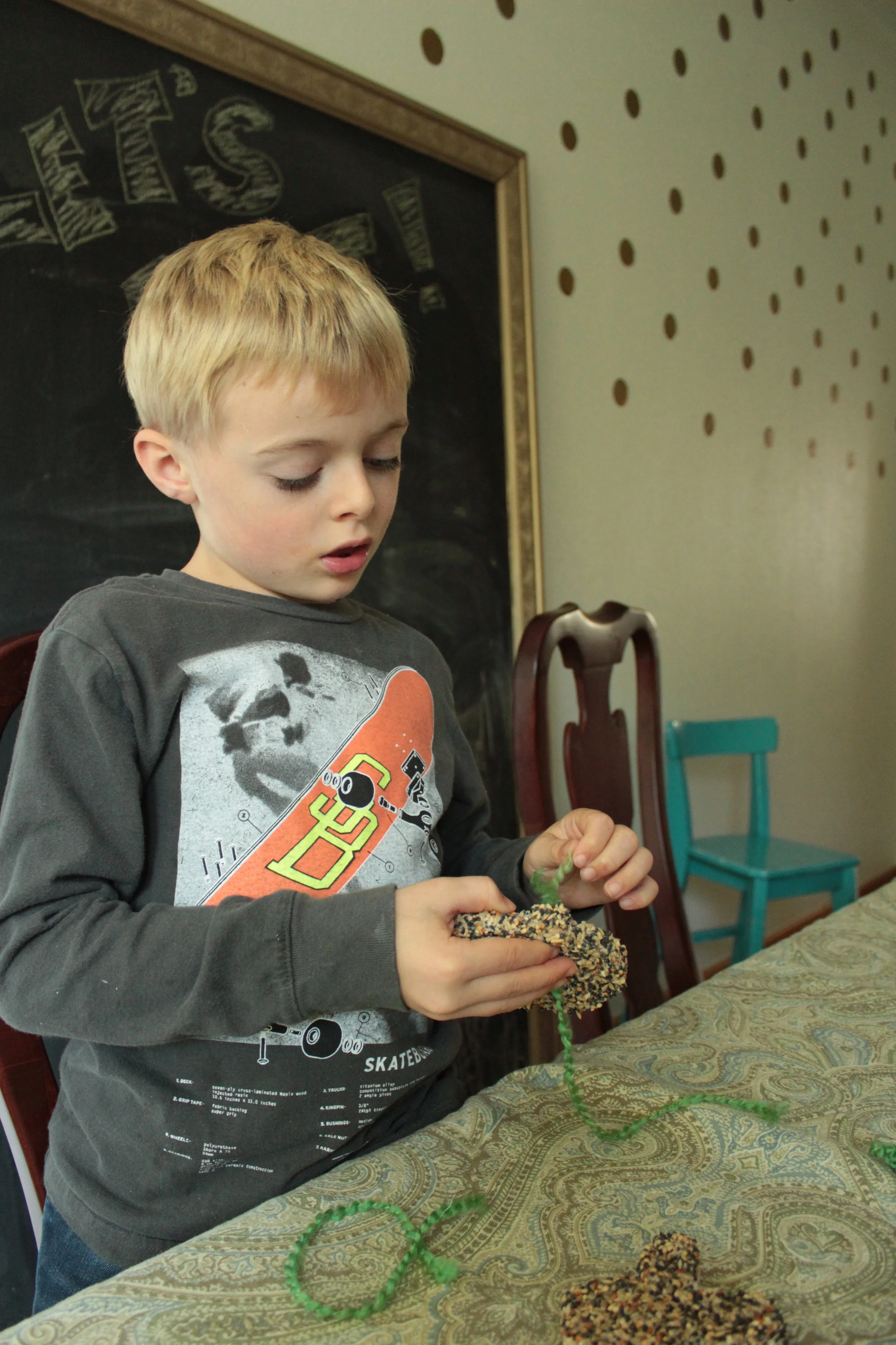 Putting the yarn through the hole for hanging the cookie.
