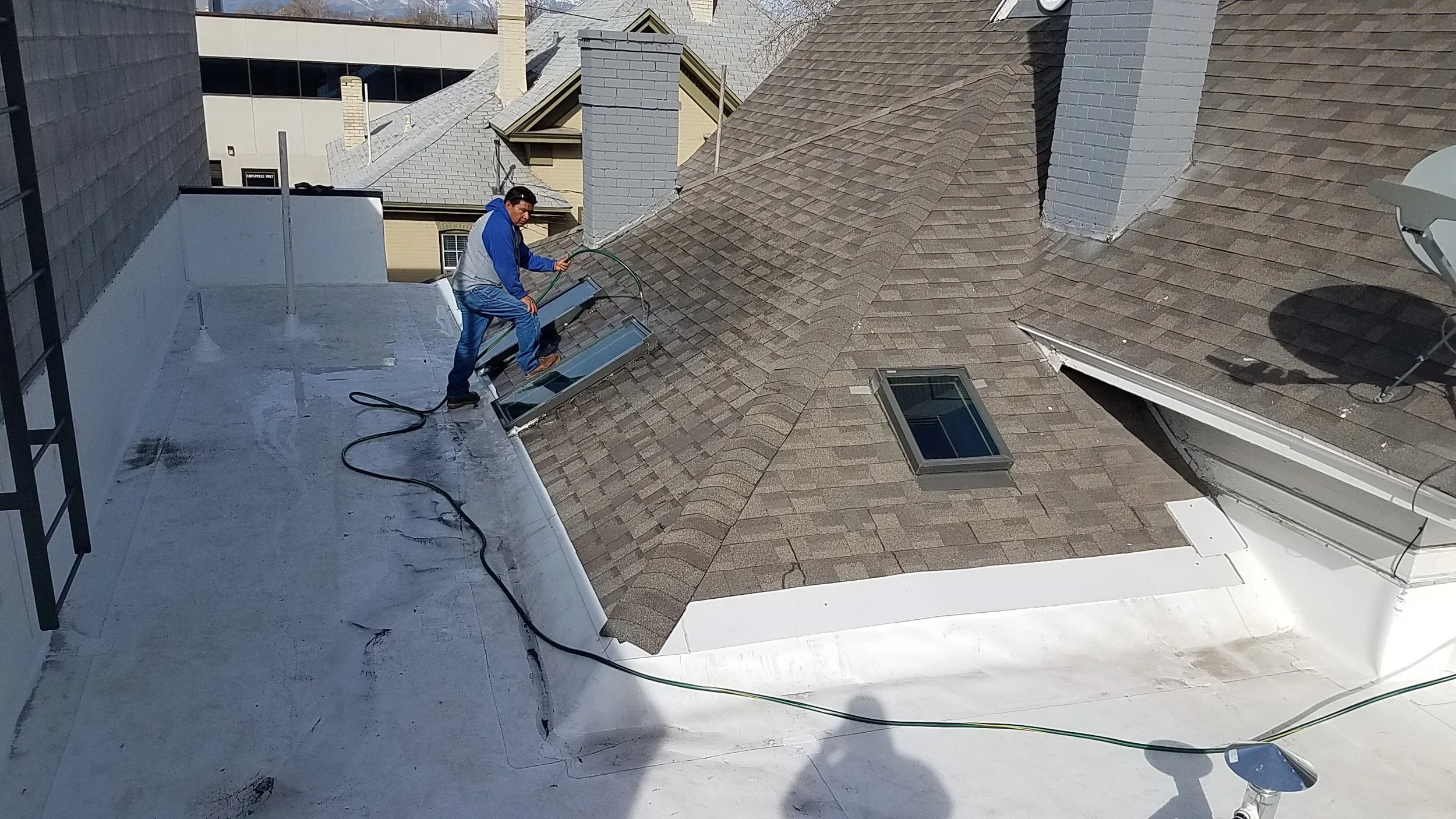 Flooding the roof above the lobby to try and find the leak.
