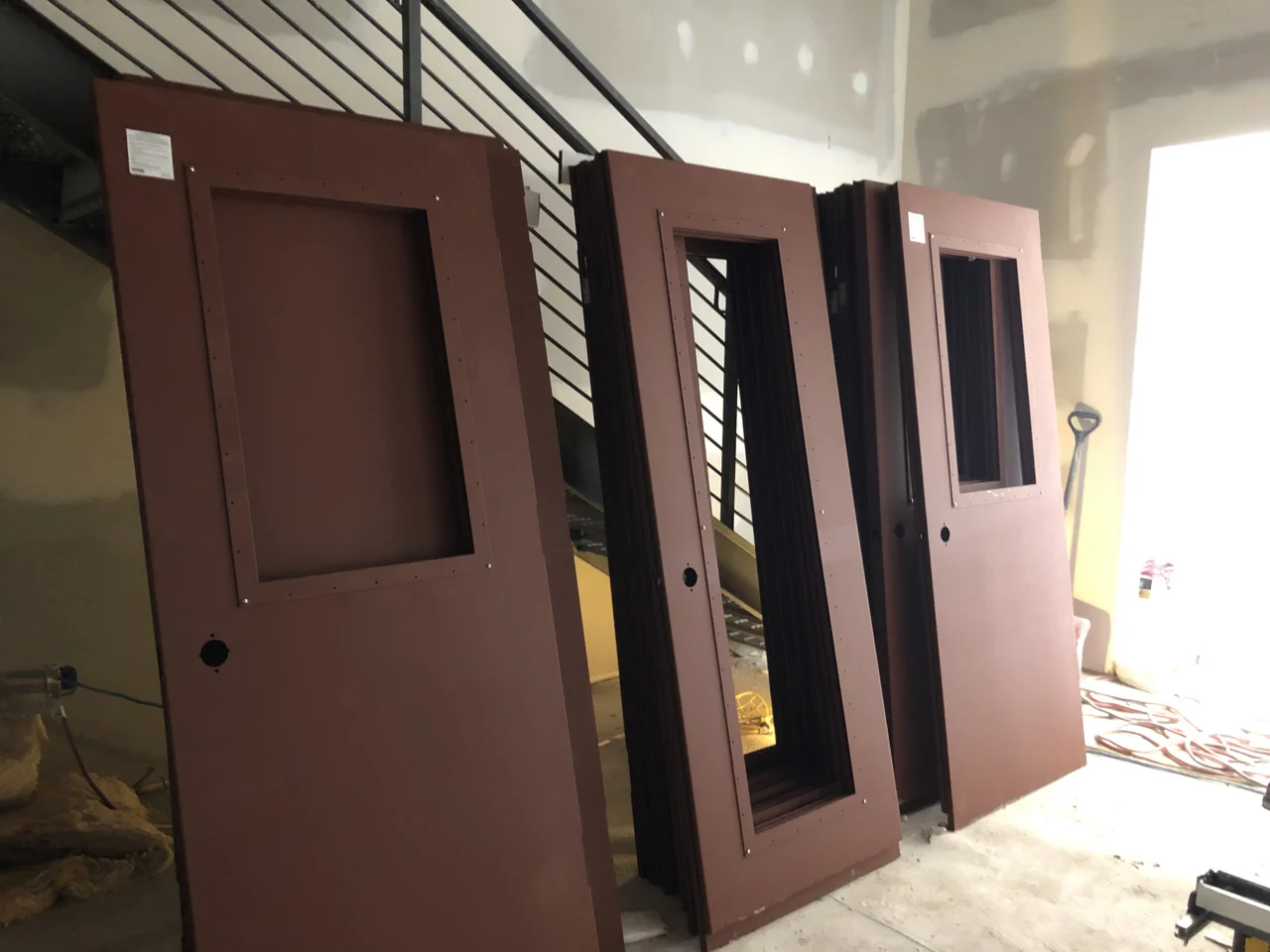 On Thursday the Overly acoustic doors arrived. The doors are so heavy that the installers - three big guys, have a hard time lifting them and getting them on the hinges. The solid slabs are 51db doors and the doors with windows are 47db.