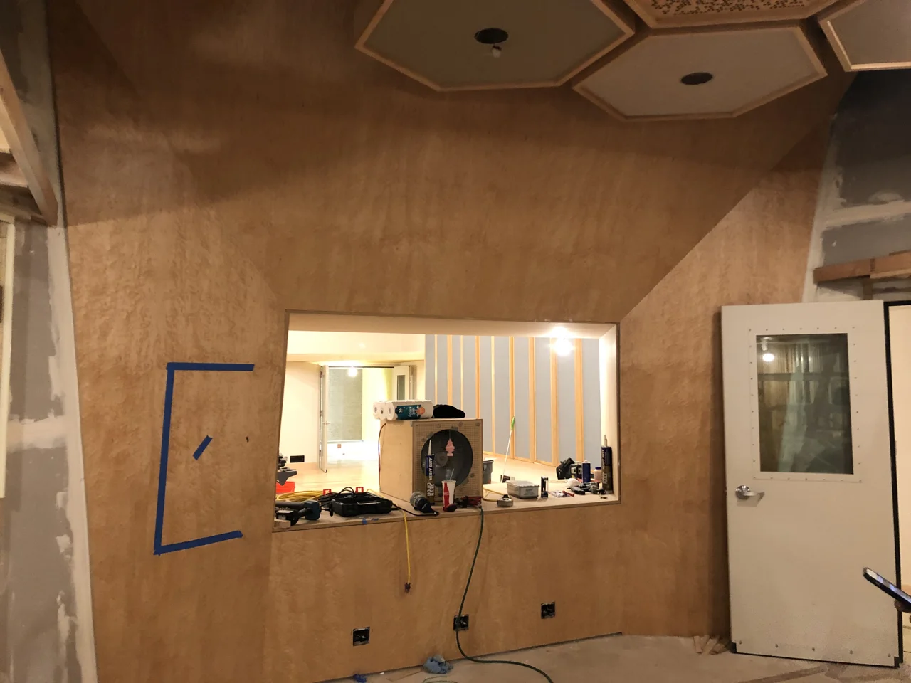 The birdseye maple front wall in control room 1. The speaker soffit boxes are behind the maple ready to be routed out.