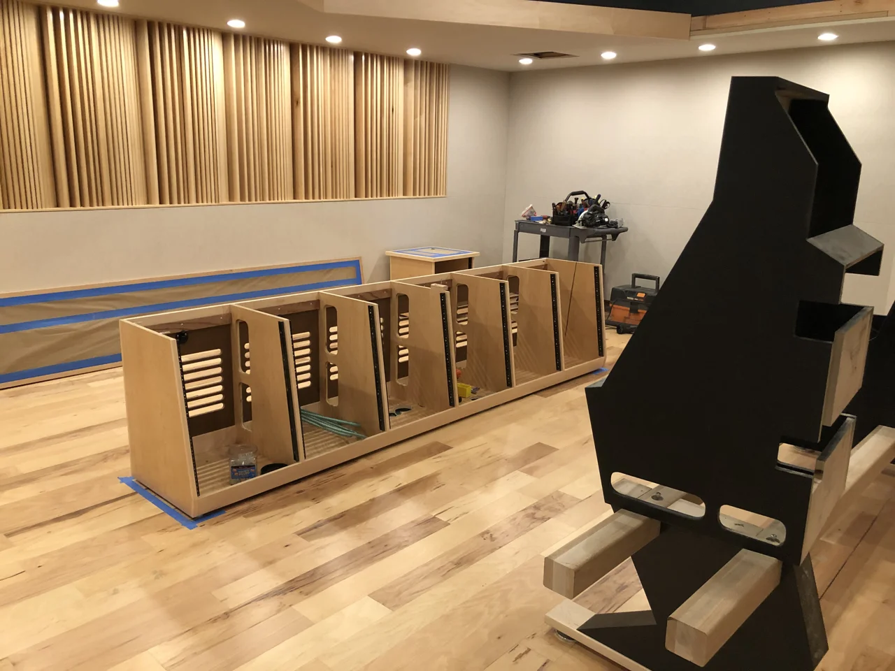 A few days before Brett Acoustics left the site they started setting the credenzas and building the desks for the consoles.