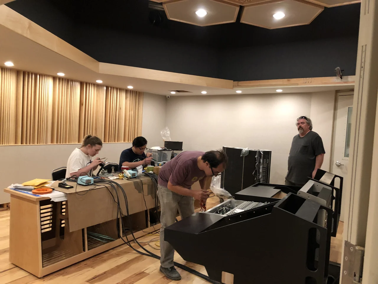 Maren, Ryan King, Thom Canova and Tony Brett working in control room 1.