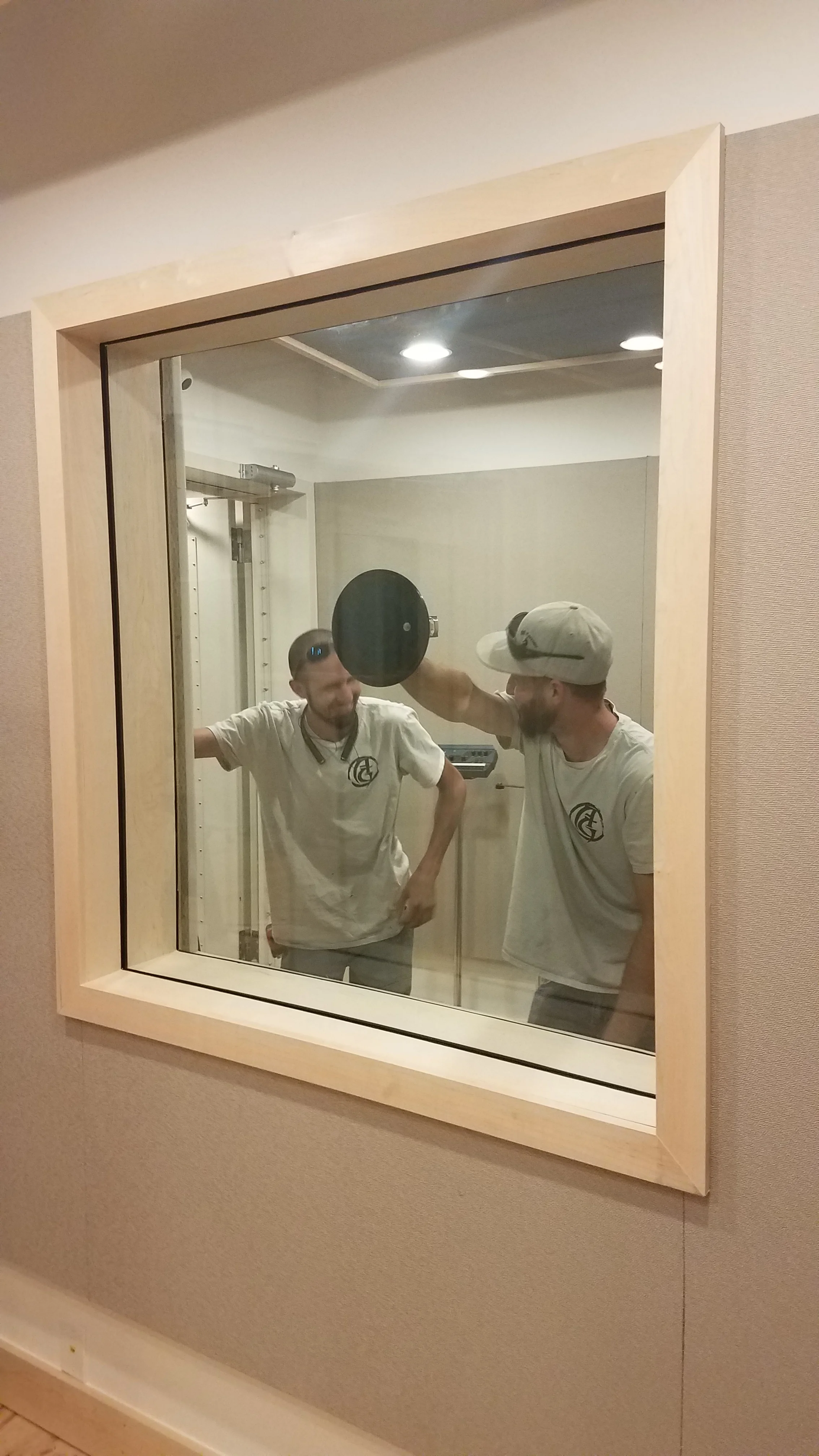 Setting the glass in the iso booths of studio 1.