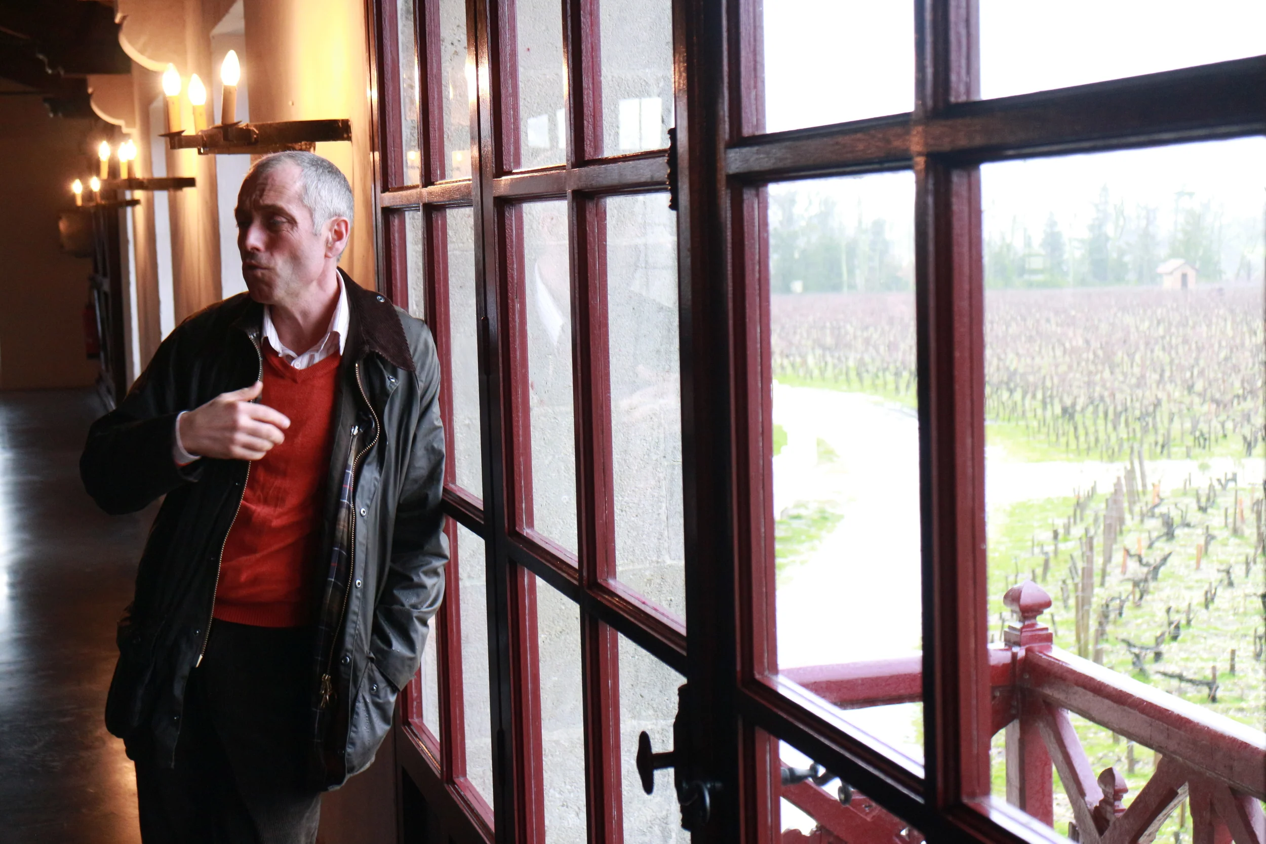 Jean Michel Comme holding court in full view of the vineyards of Pontet Canet.