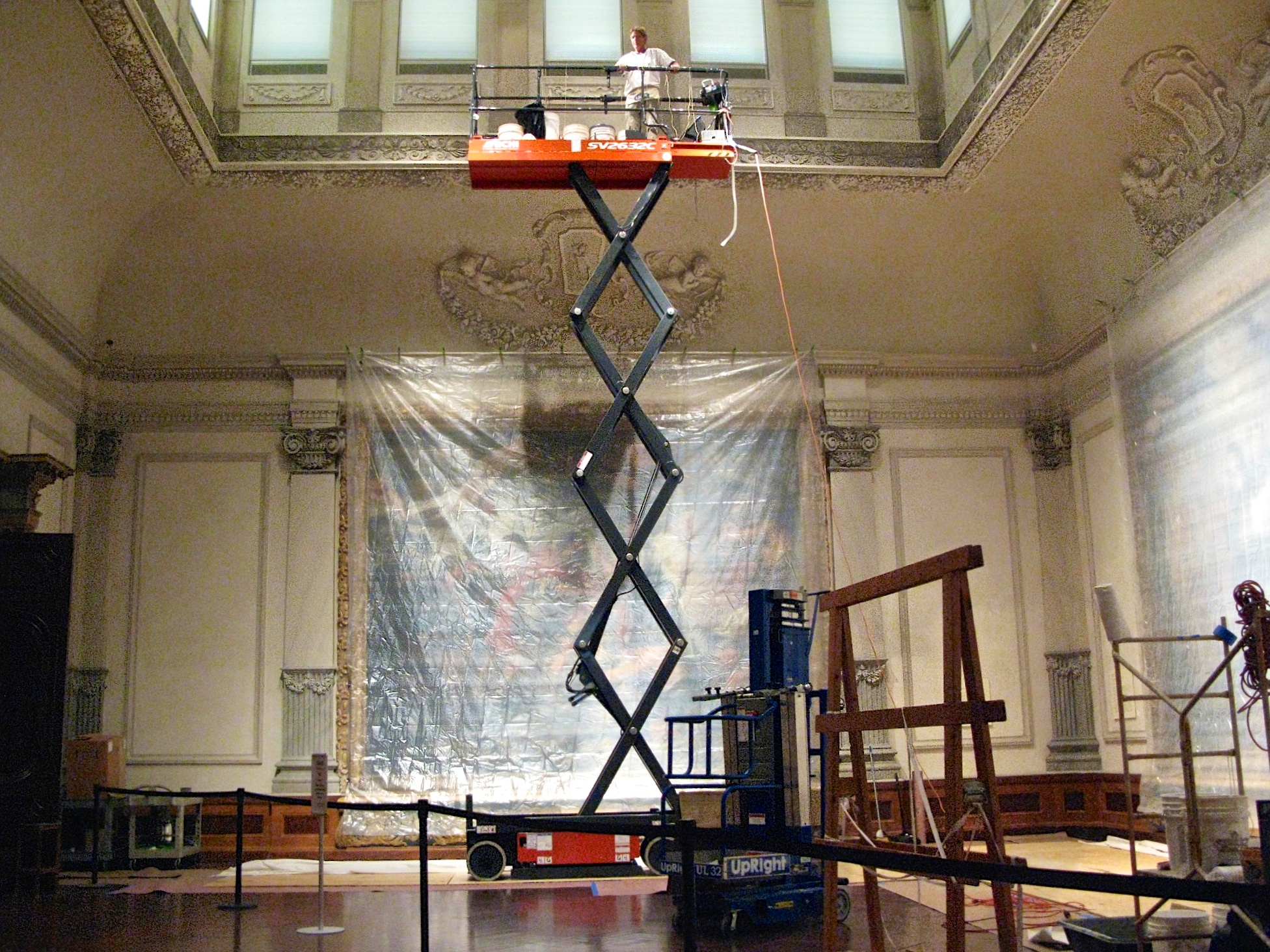 Jonathan Pettus restoring decorative plaster surface structures in the Rubens Gallery at the Ringling.