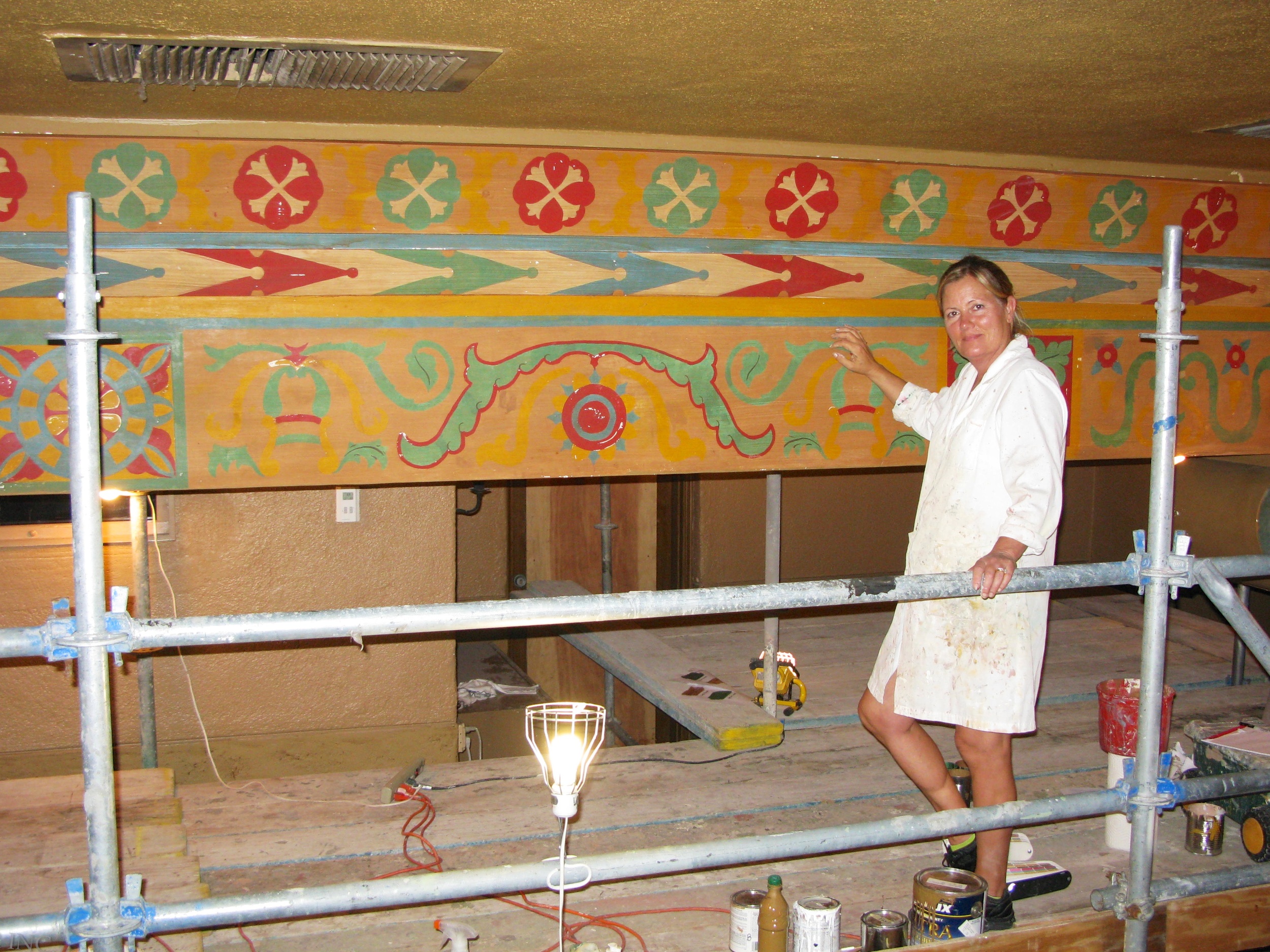 Alene Pettus restoring the decorative paint at the Annie Russell Theatre at Rollins College.