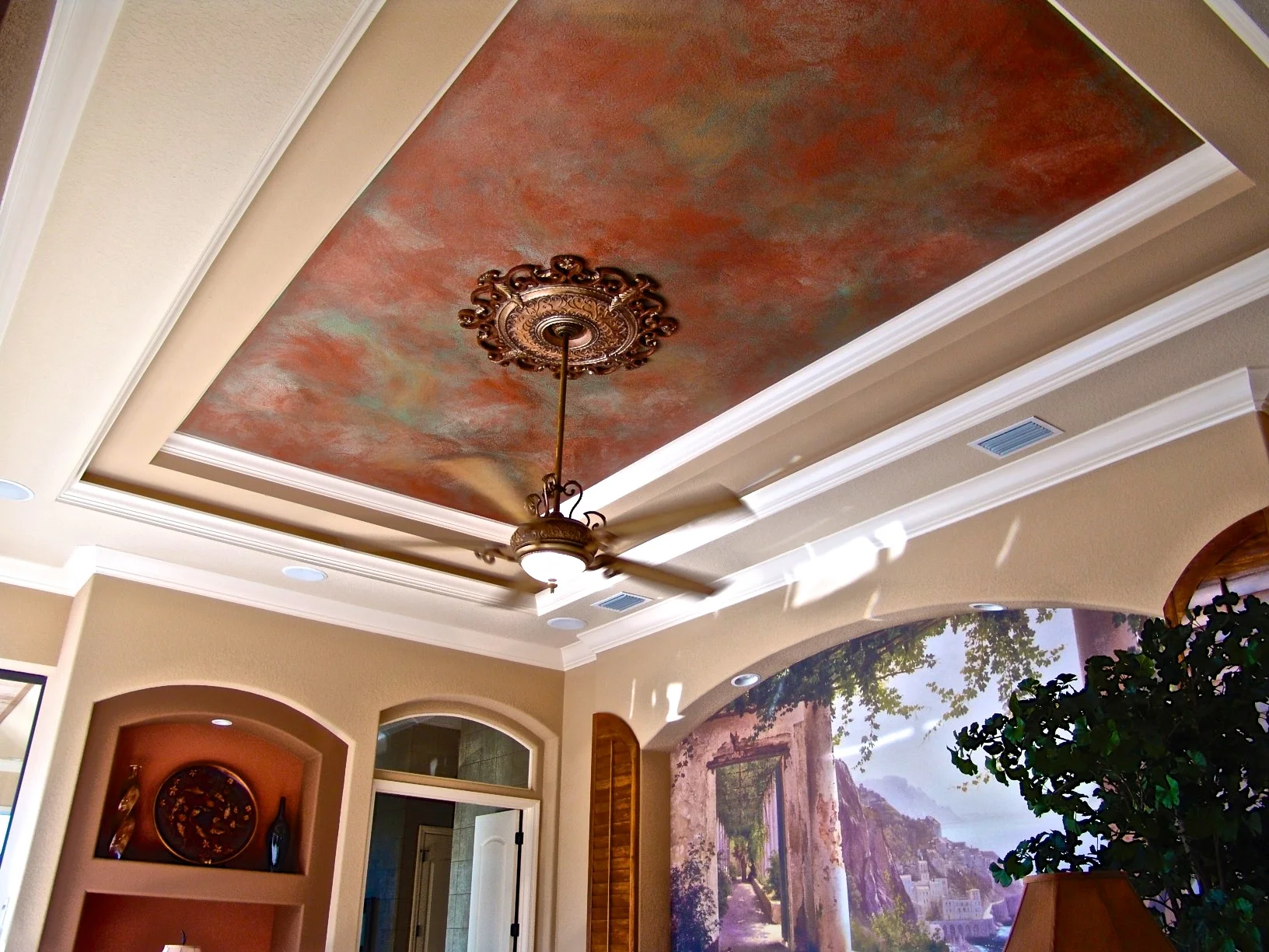 Tray ceiling sponged in verdi copper metallics for a faux stone finish.