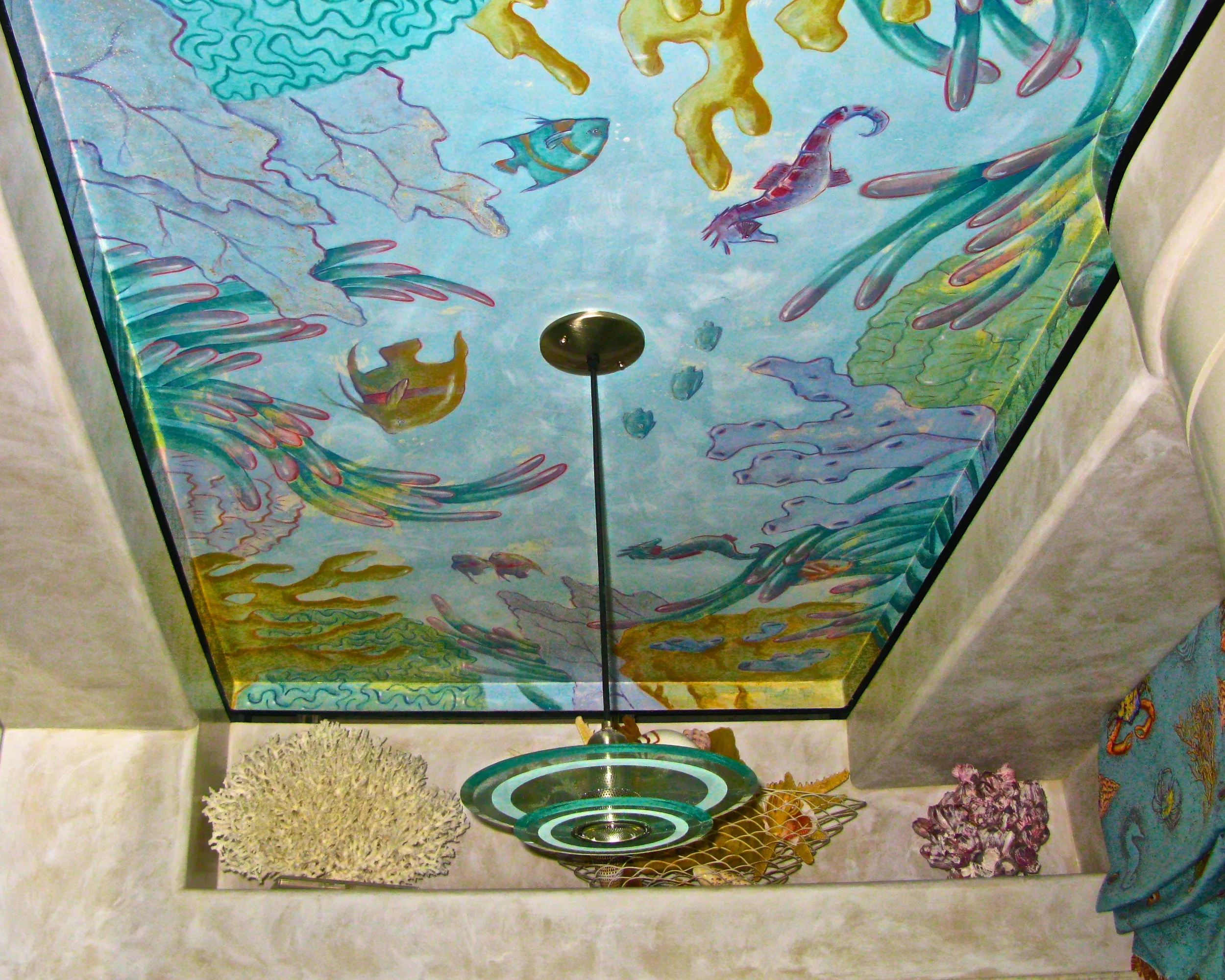 Venetian Plaster ceiling handpainted with fish and corals. Walls are a limed Venetian Plaster faux Crema Marfil marble.