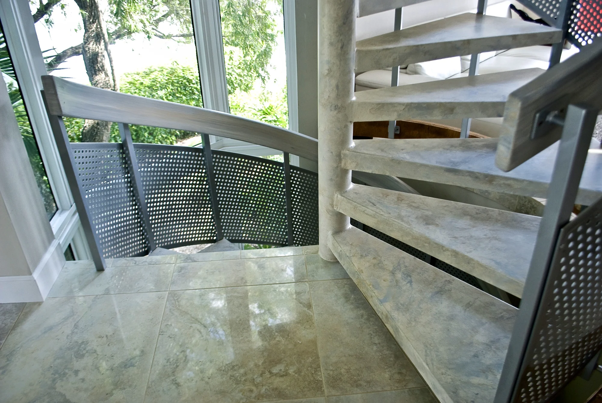Faux marble metal spiral staircase as part of a complete condominium renovation.