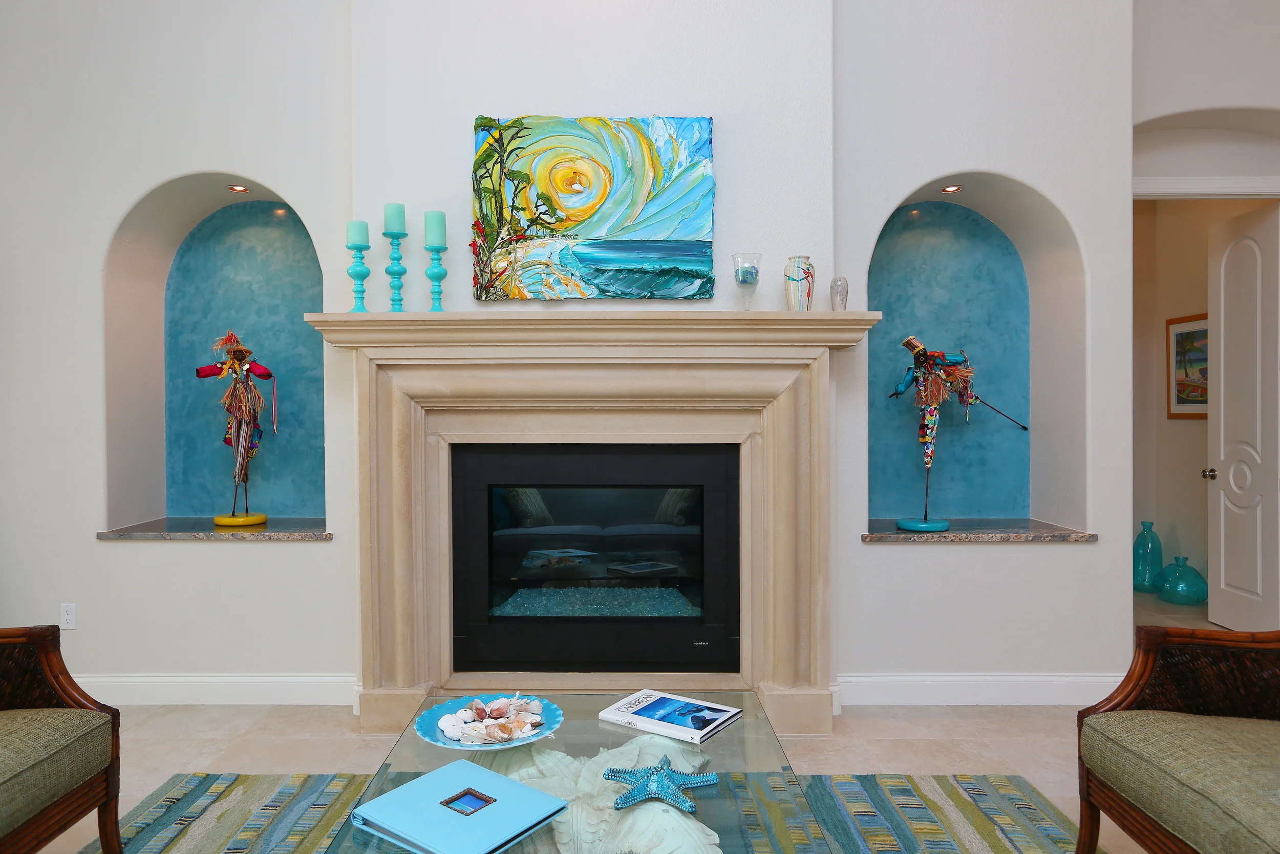 Niches in an aqua-colored satin pearl striae finish using Venetian Plaster.