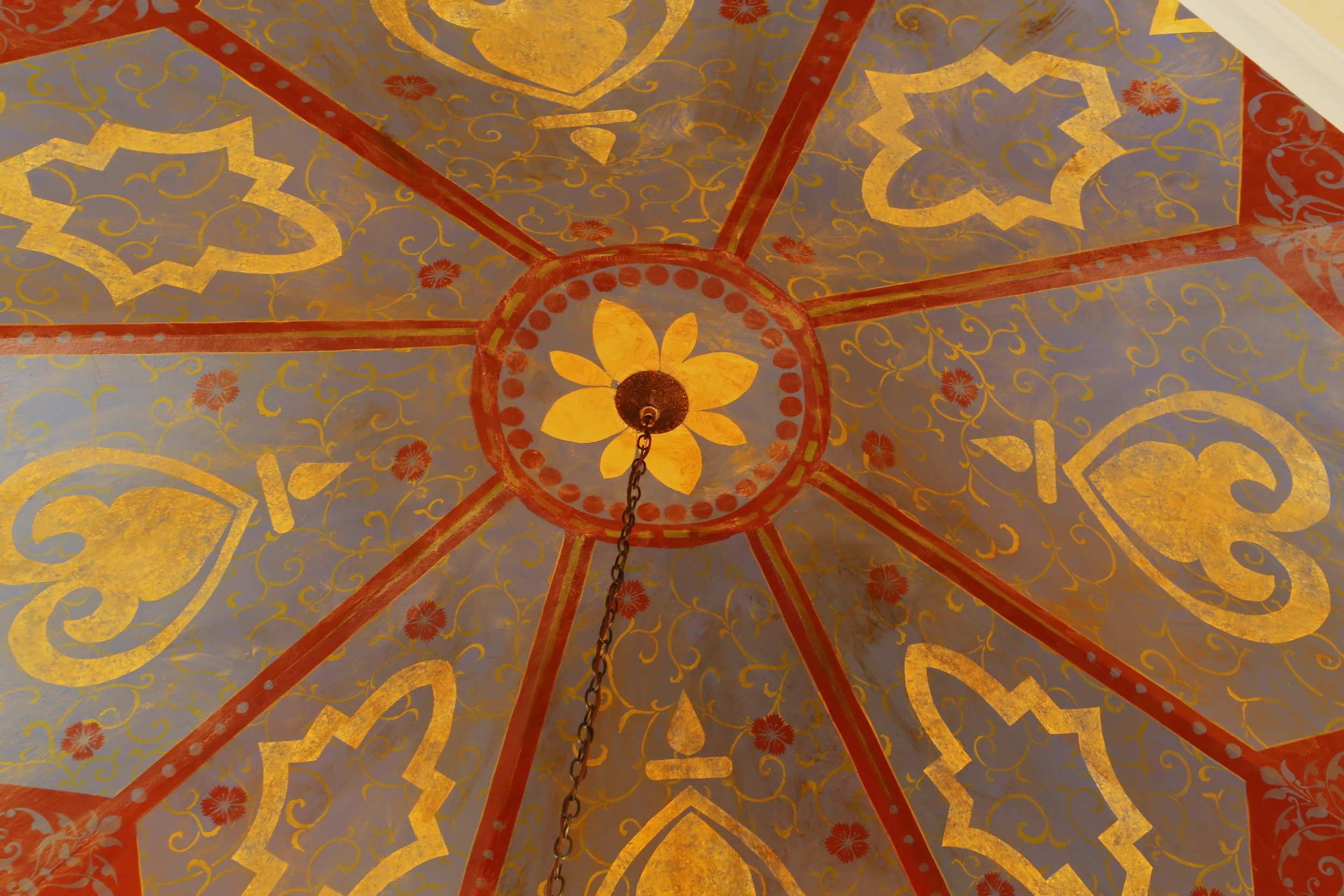 Tray ceiling finished in layers of stencils for a Moroccan-inspired design.