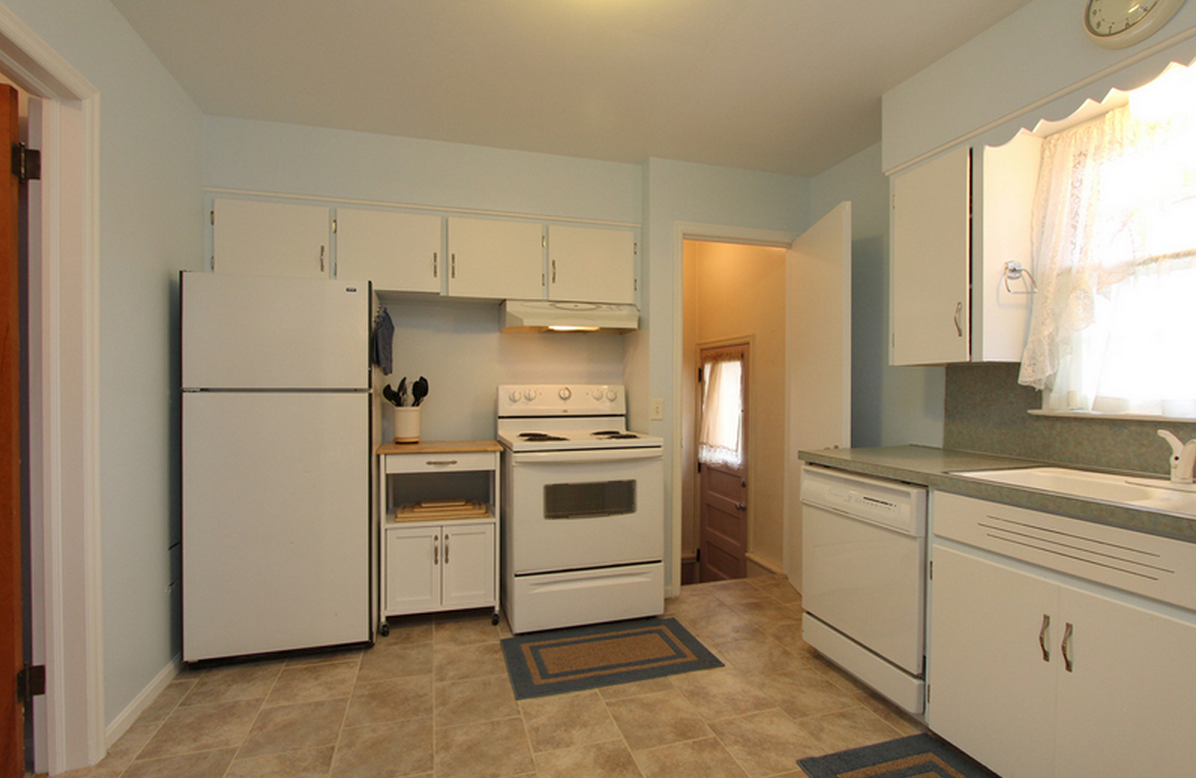 Kitchen facing back door/stairs