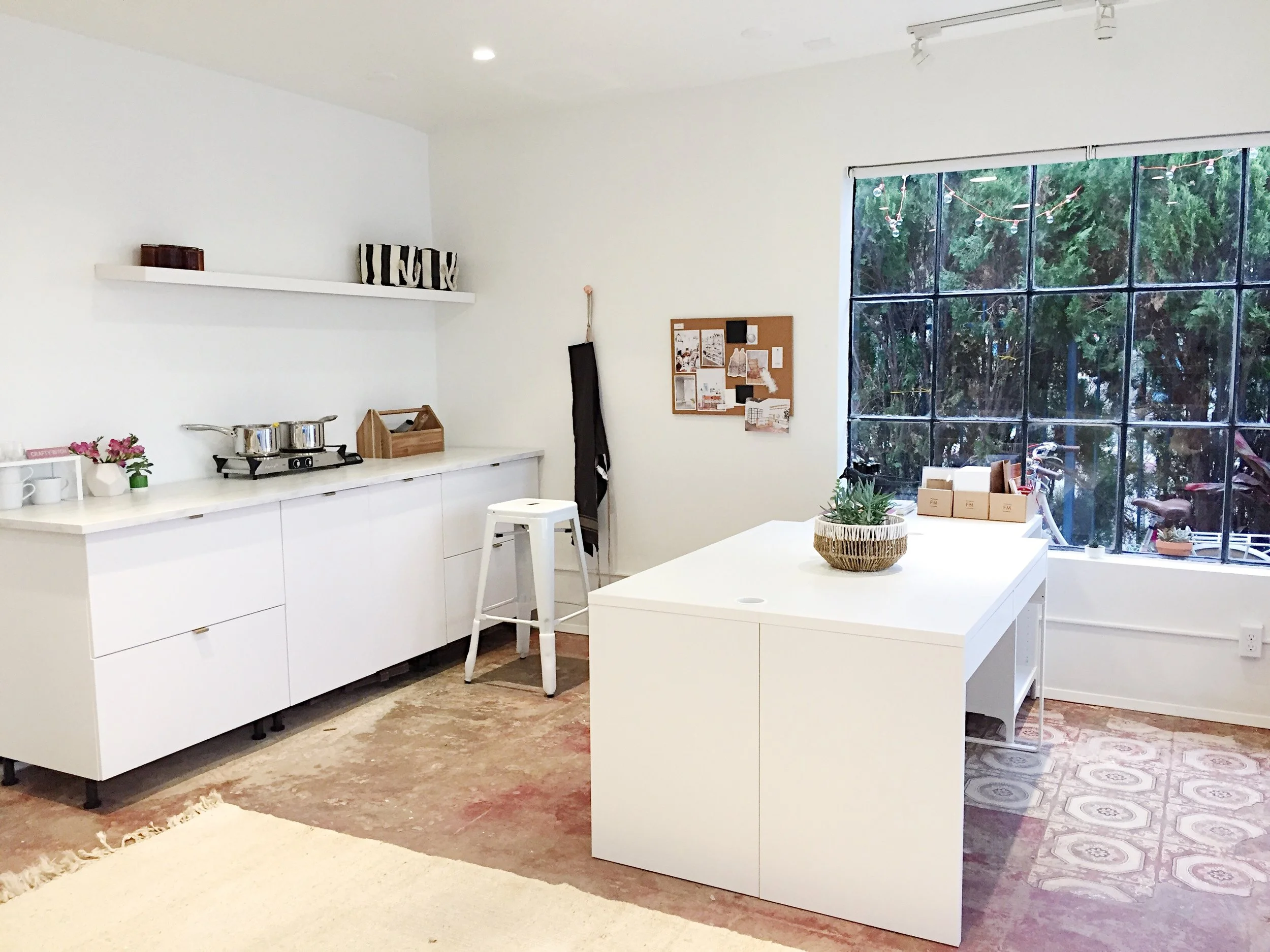  Work table, desks and storage with supplies. 