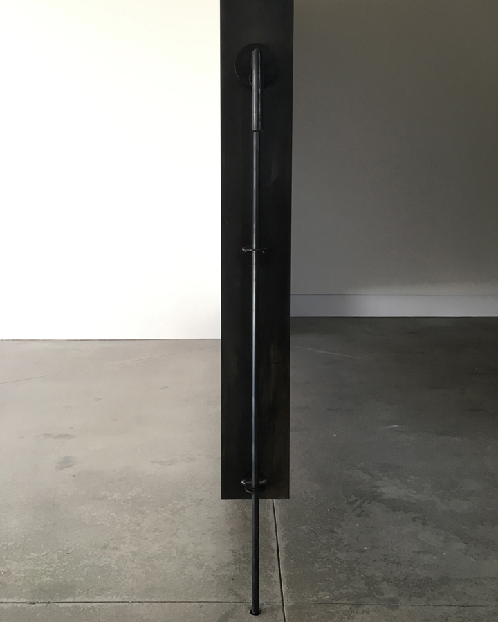 Pivot Wall Blackened Steel frames this wall with custom latch to hold in place. 