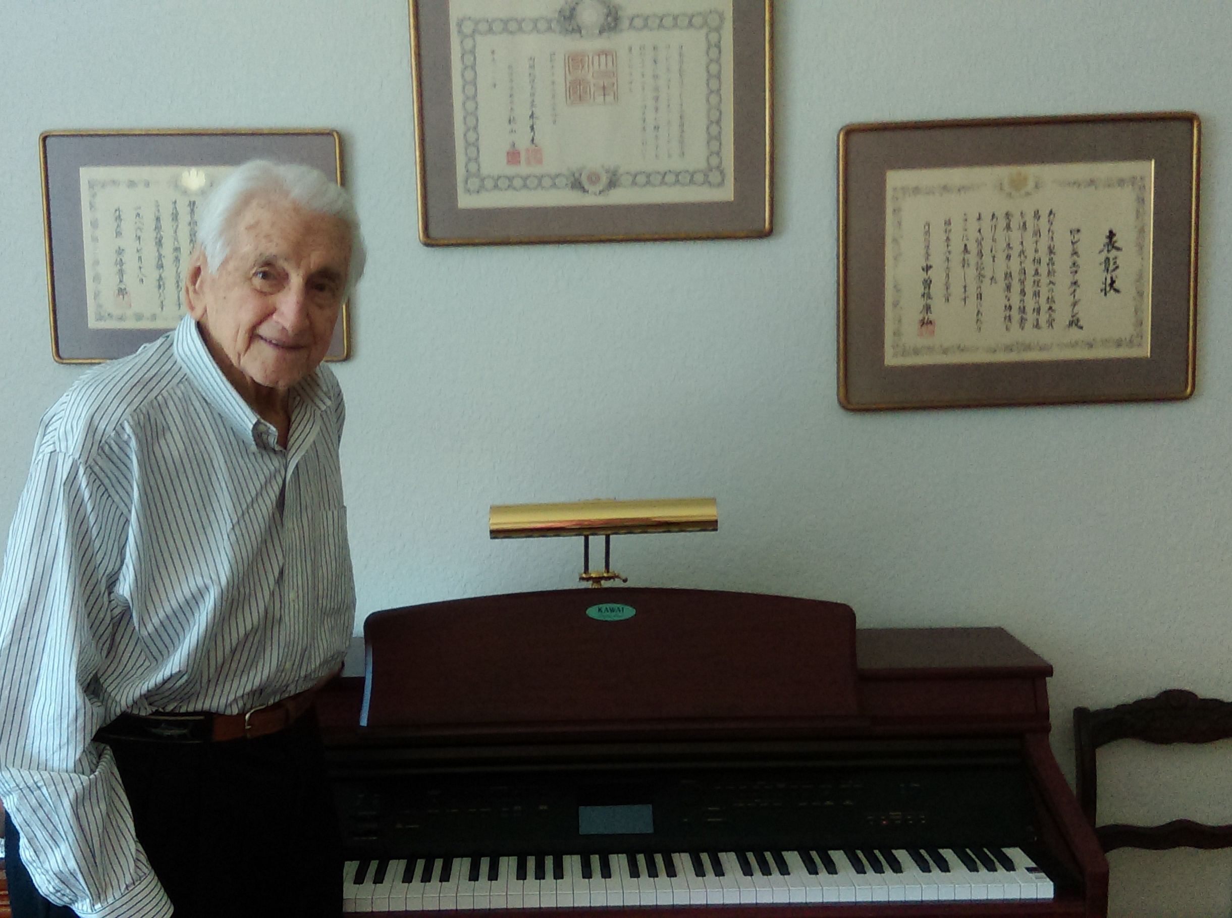 Lt. Gen. Snowden poses with his personal piano, given to CCS.